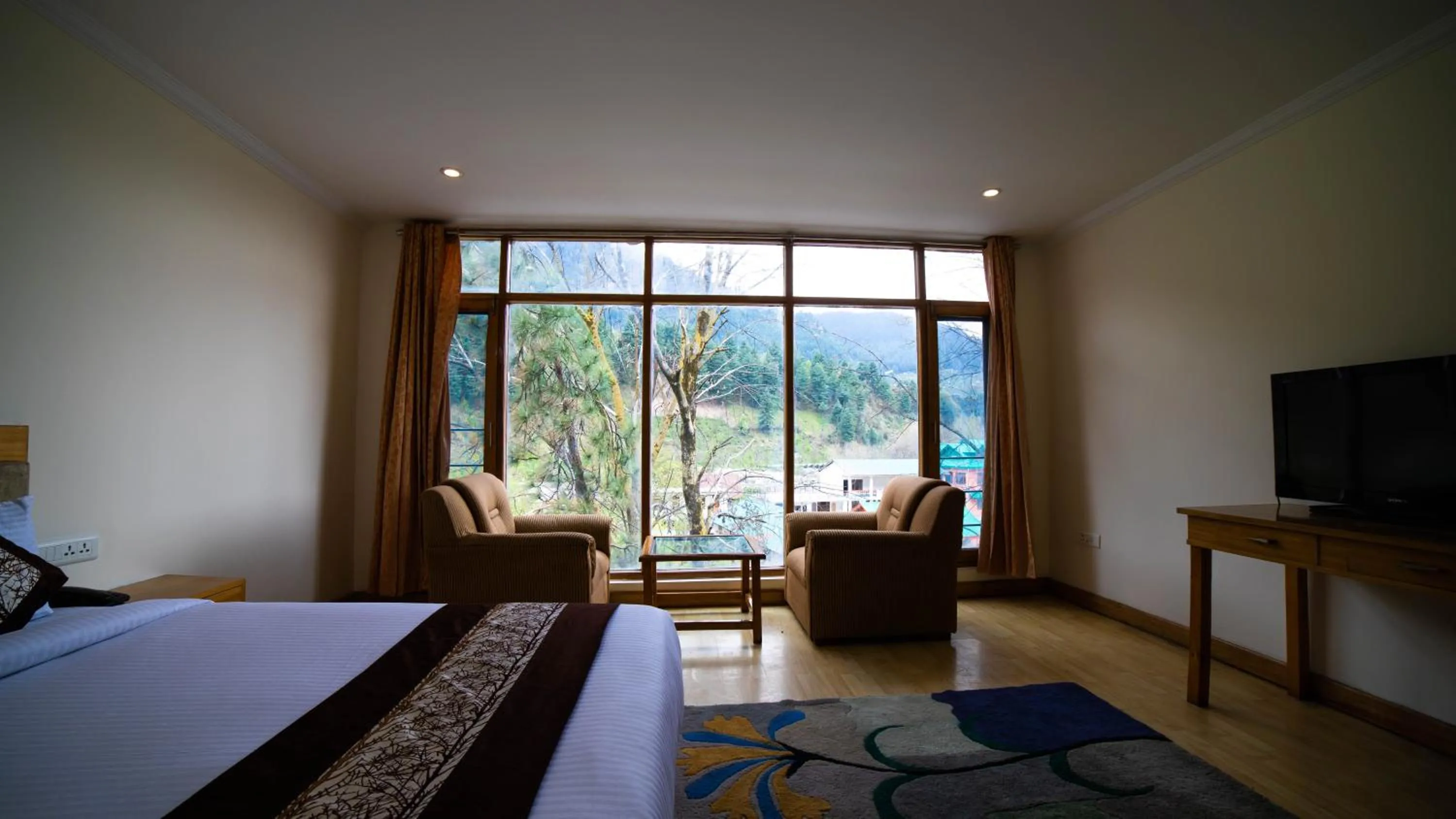 Bed in Vaayu Resorts And Spa