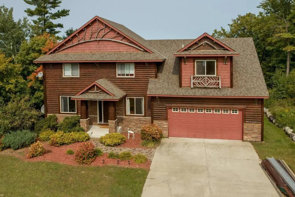 Property building in Spacious Leech Lake Home on 2 Private Acres, 200' of lake shore 15 Minutes to Walker with boat lift, dock, swimming, fire pit