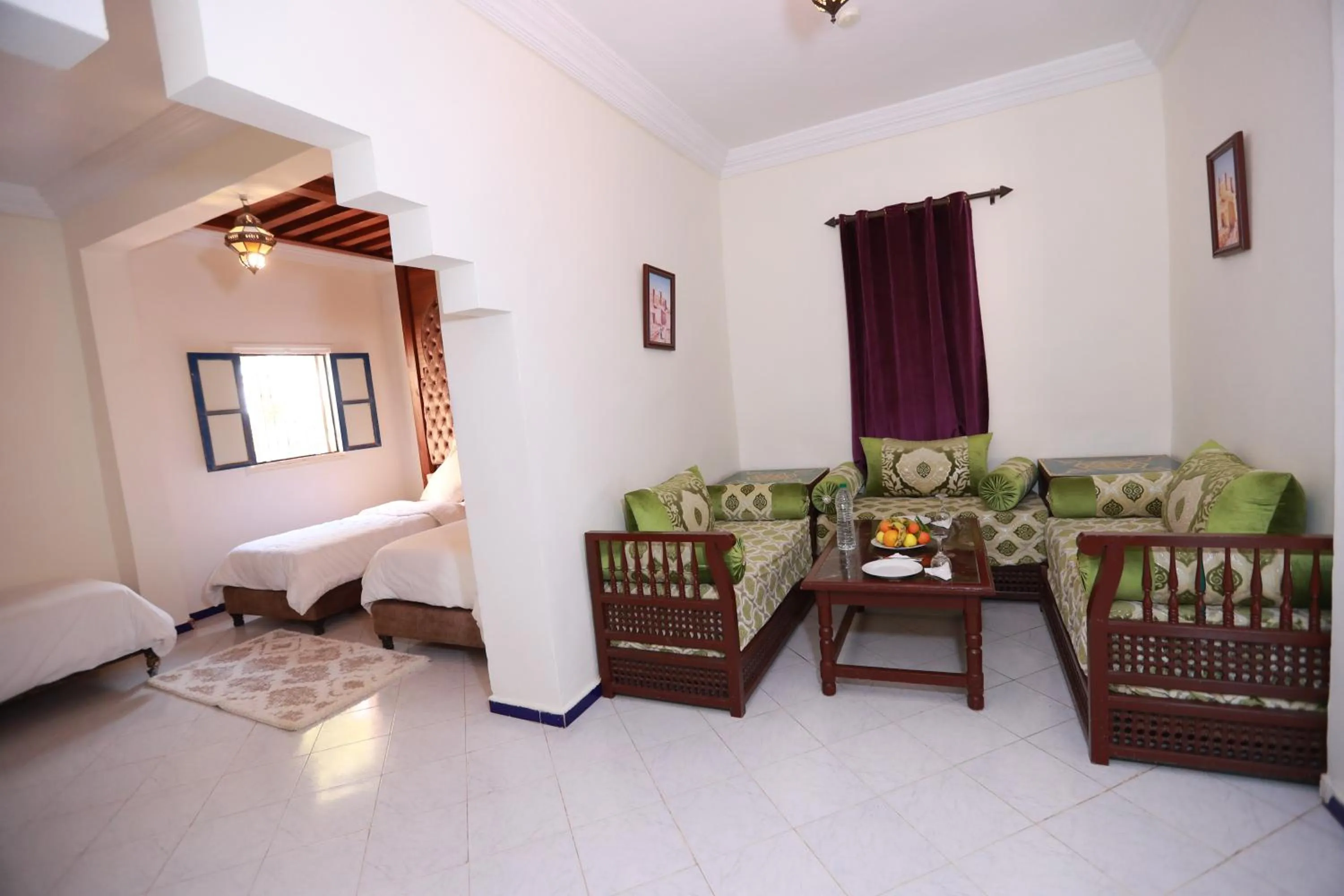 Seating area, Bed in Kasbah Tizimi