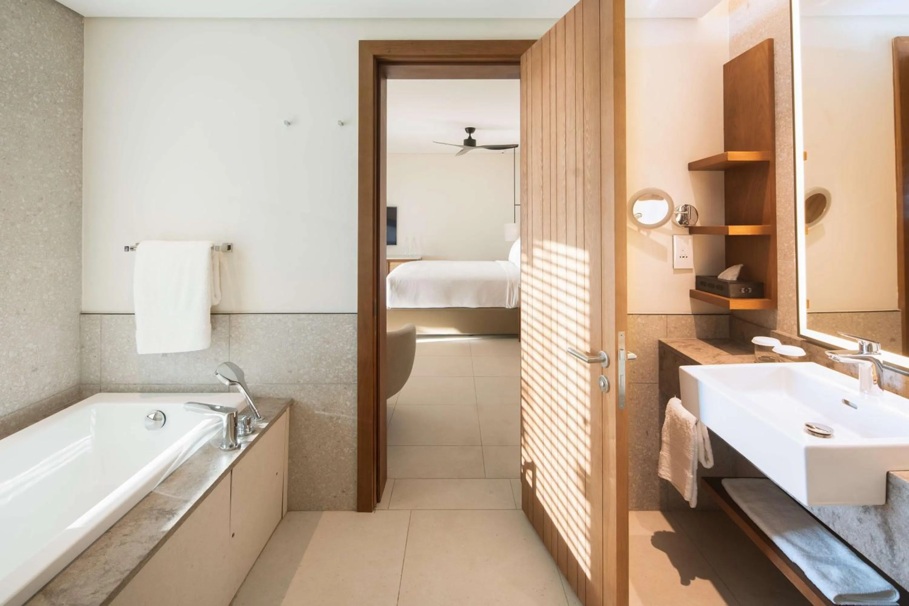 Bathroom, Bed in Hilton Mauritius Resort & Spa