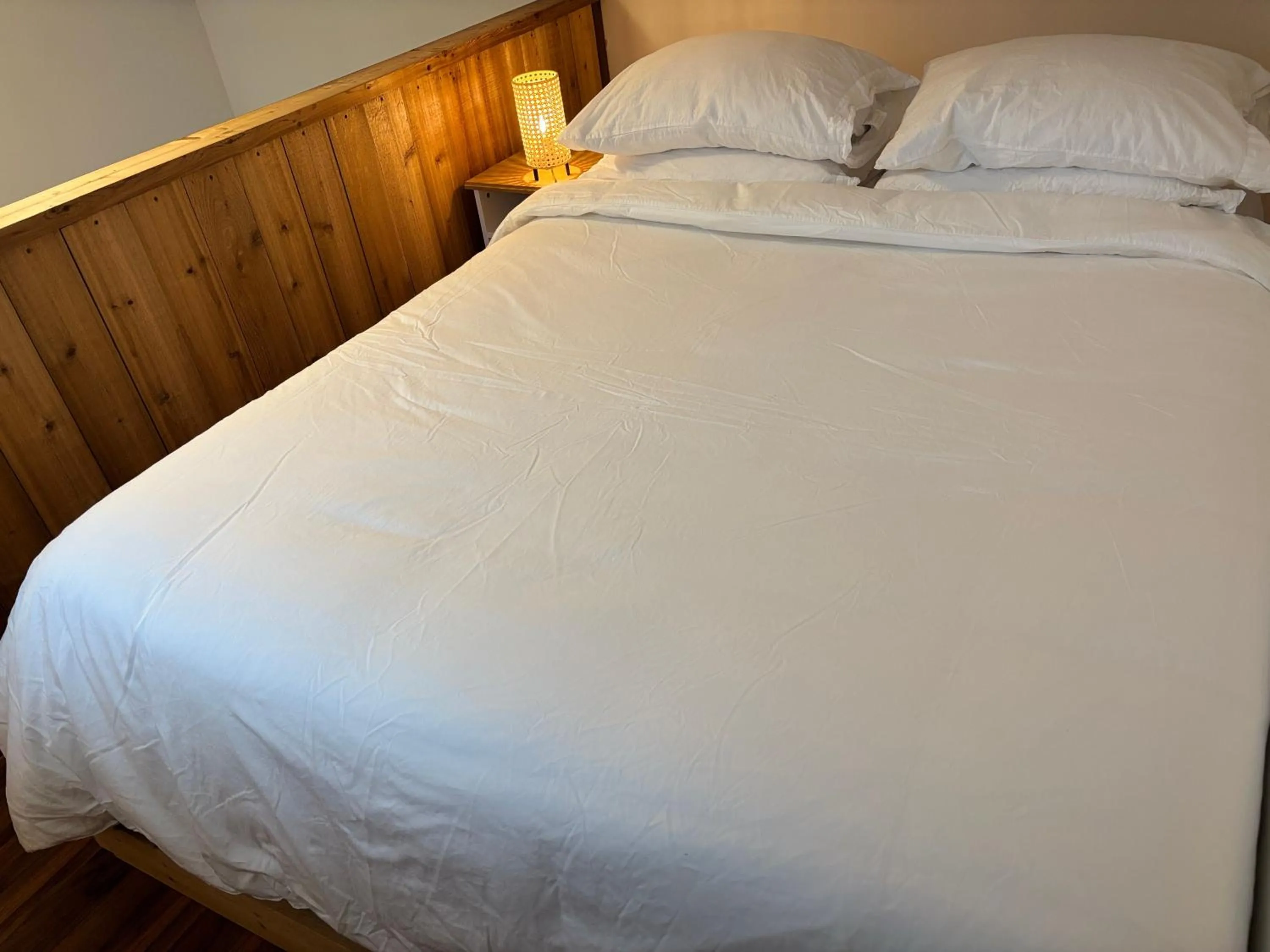 Bed in Brown's Beach Guest Suite