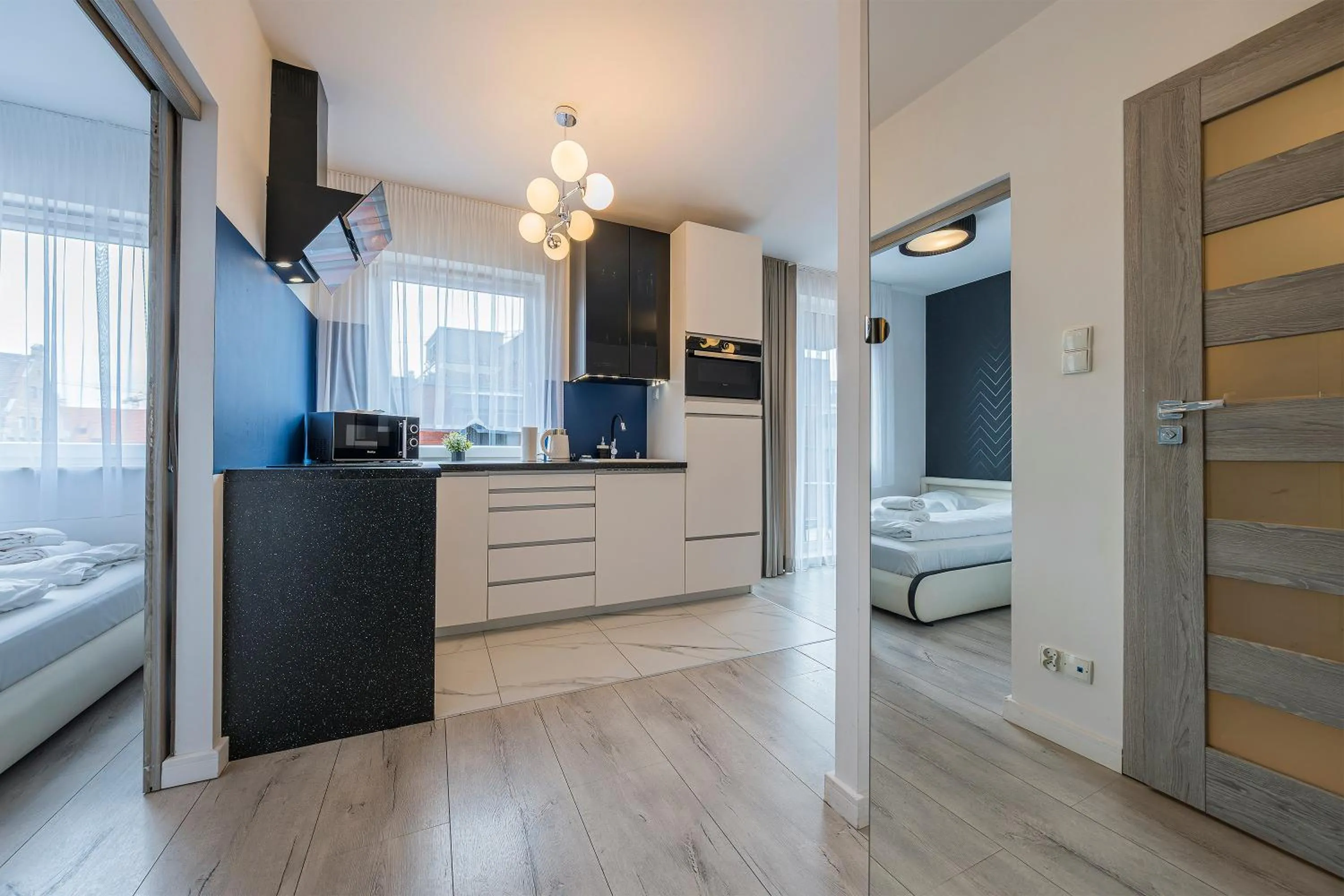 Kitchen or kitchenette, Bed in Chmielna Park by Comfort Apartments