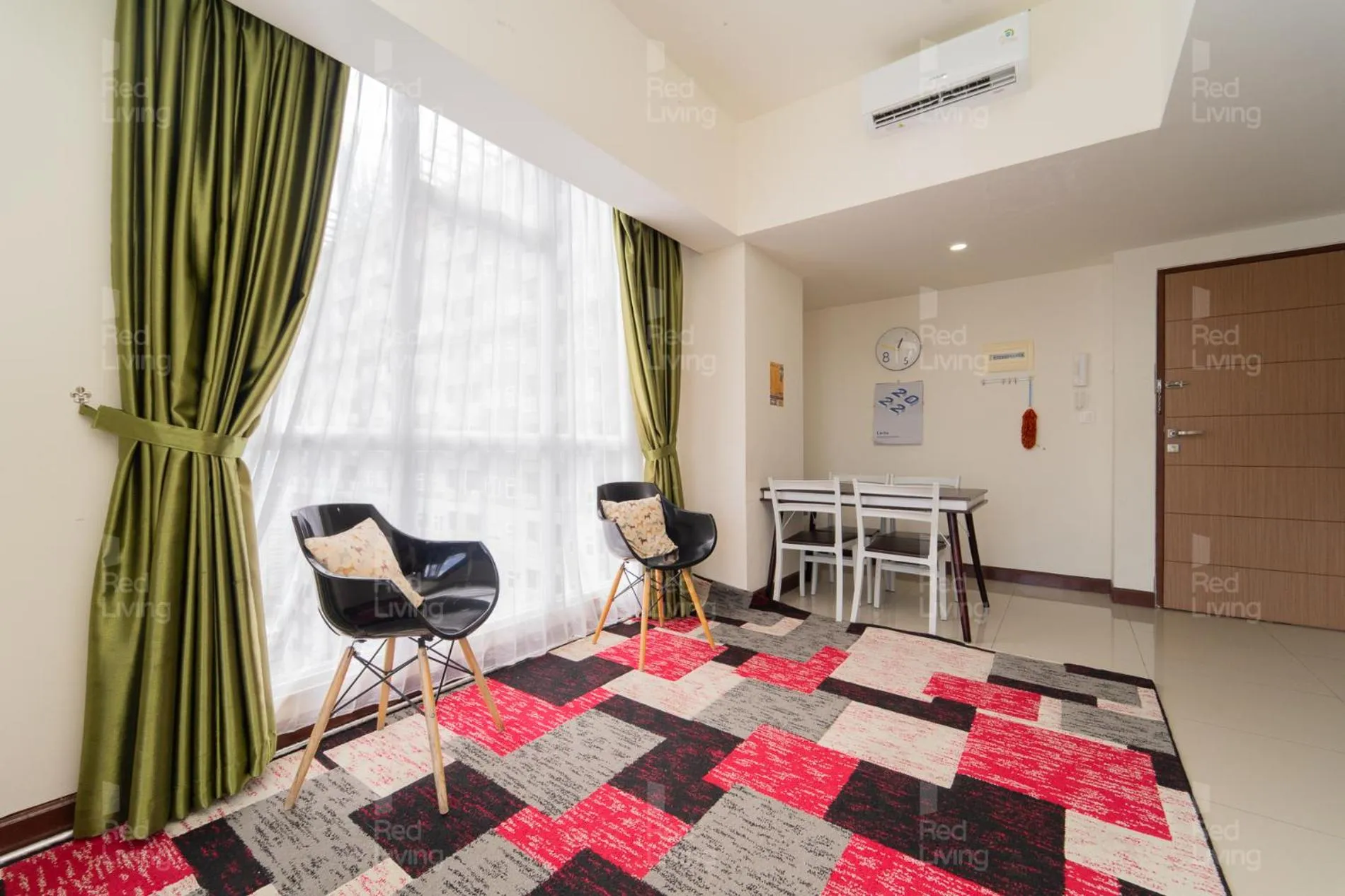 Living room in RedLiving Apartemen Vida View - Vida Connect