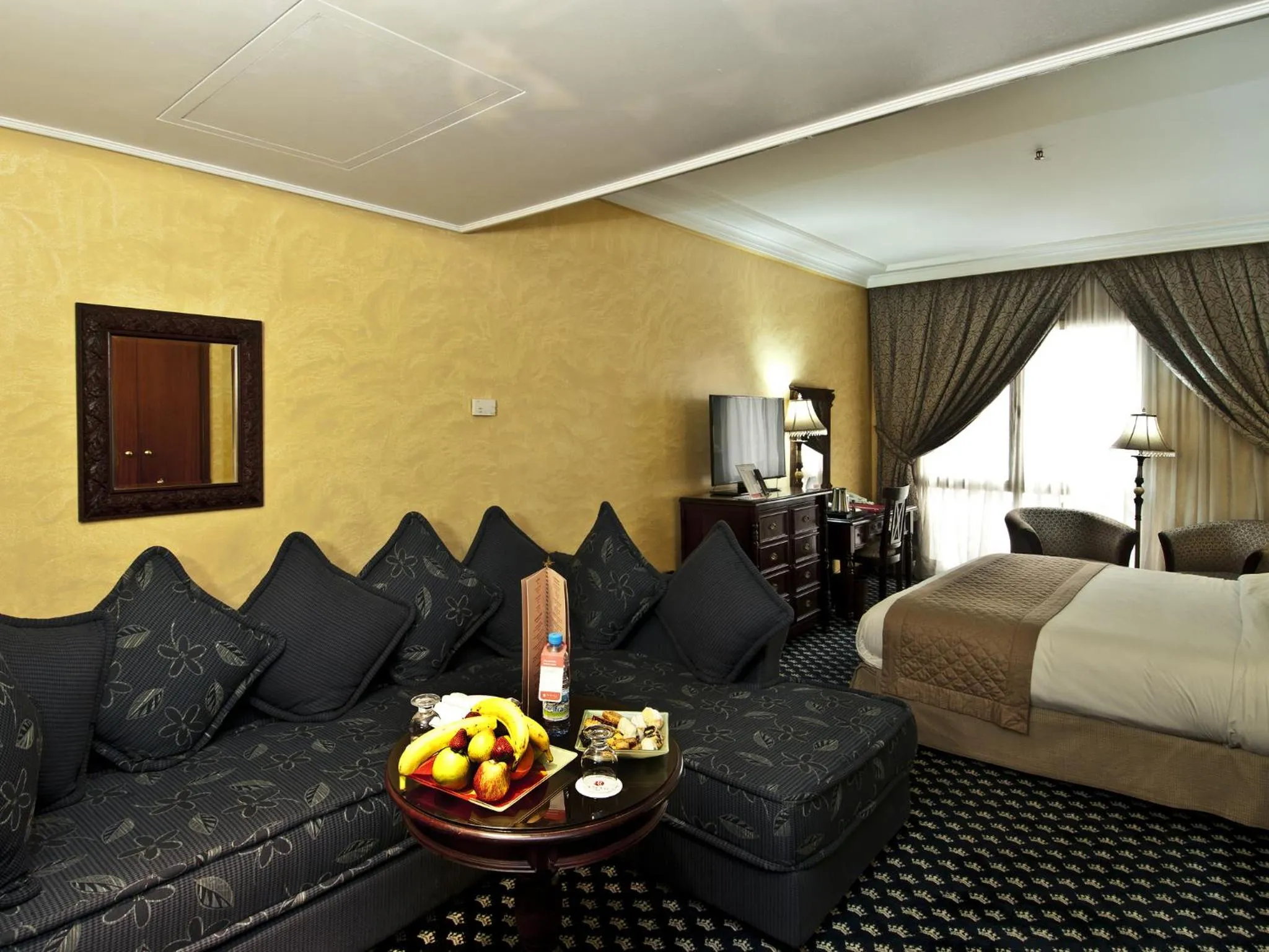 Seating area, Bed in Ramada By Wyndham Fes