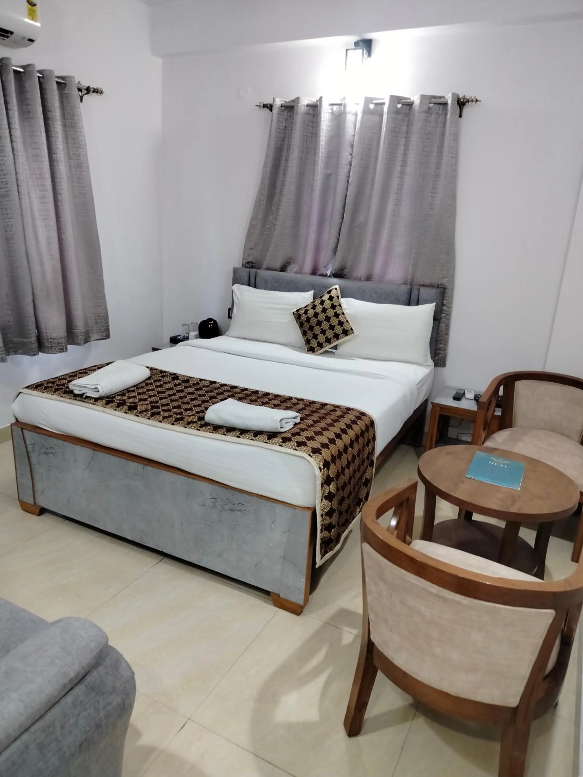 Bed in Hotel Aman Residency