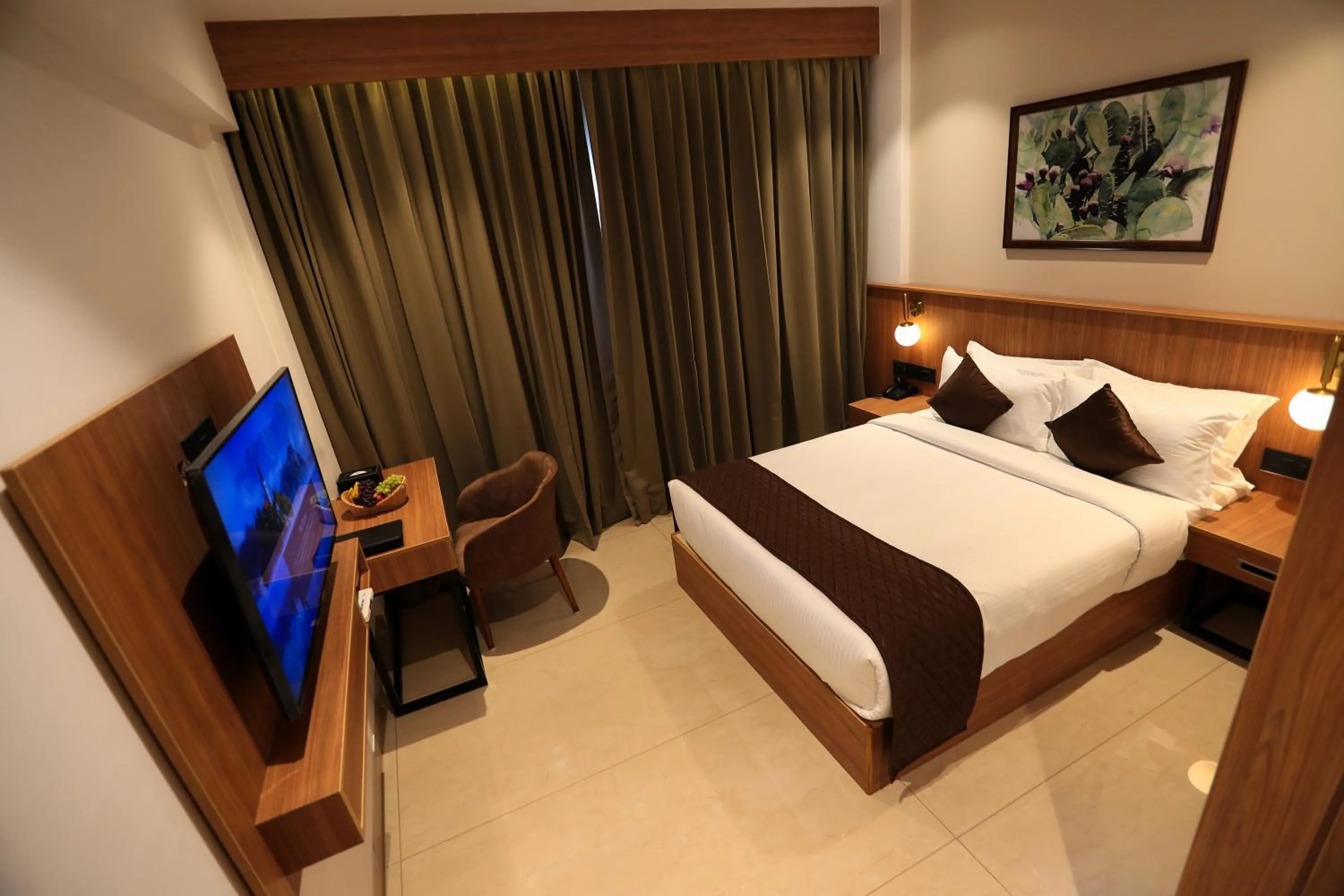 Bed in Hotel Saffron Wayanad