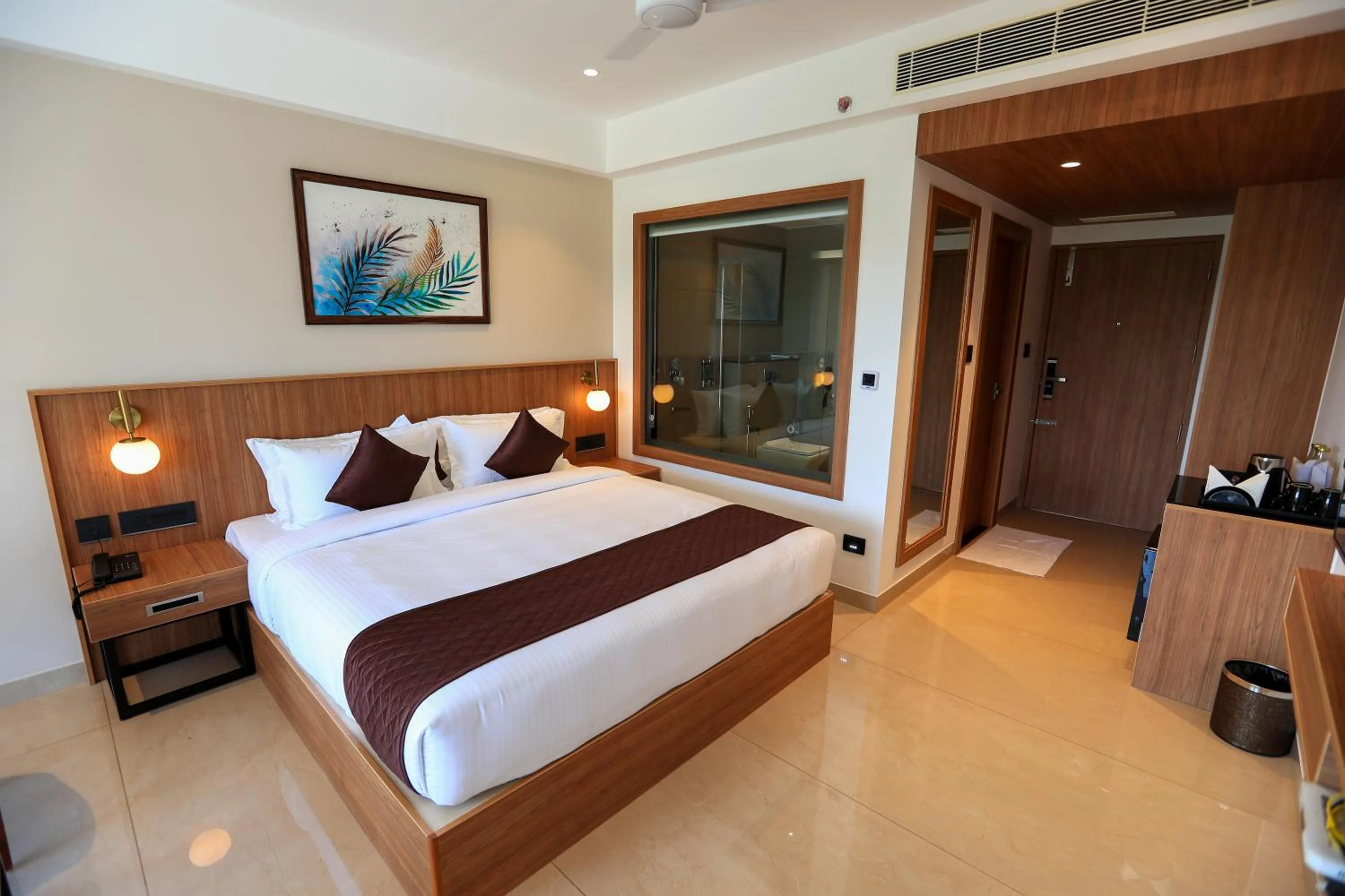 Bed in Hotel Saffron Wayanad