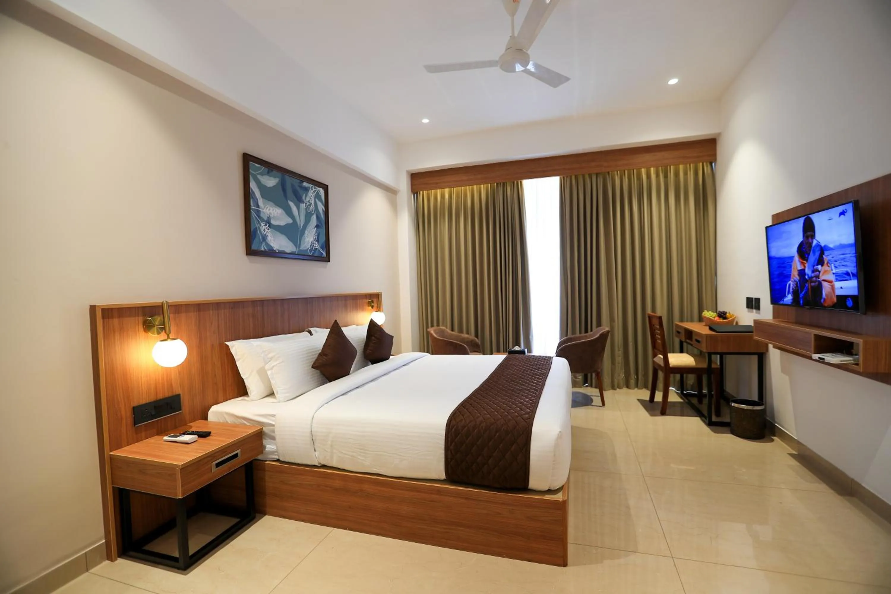 Communal lounge/ TV room, Bed in Hotel Saffron Wayanad