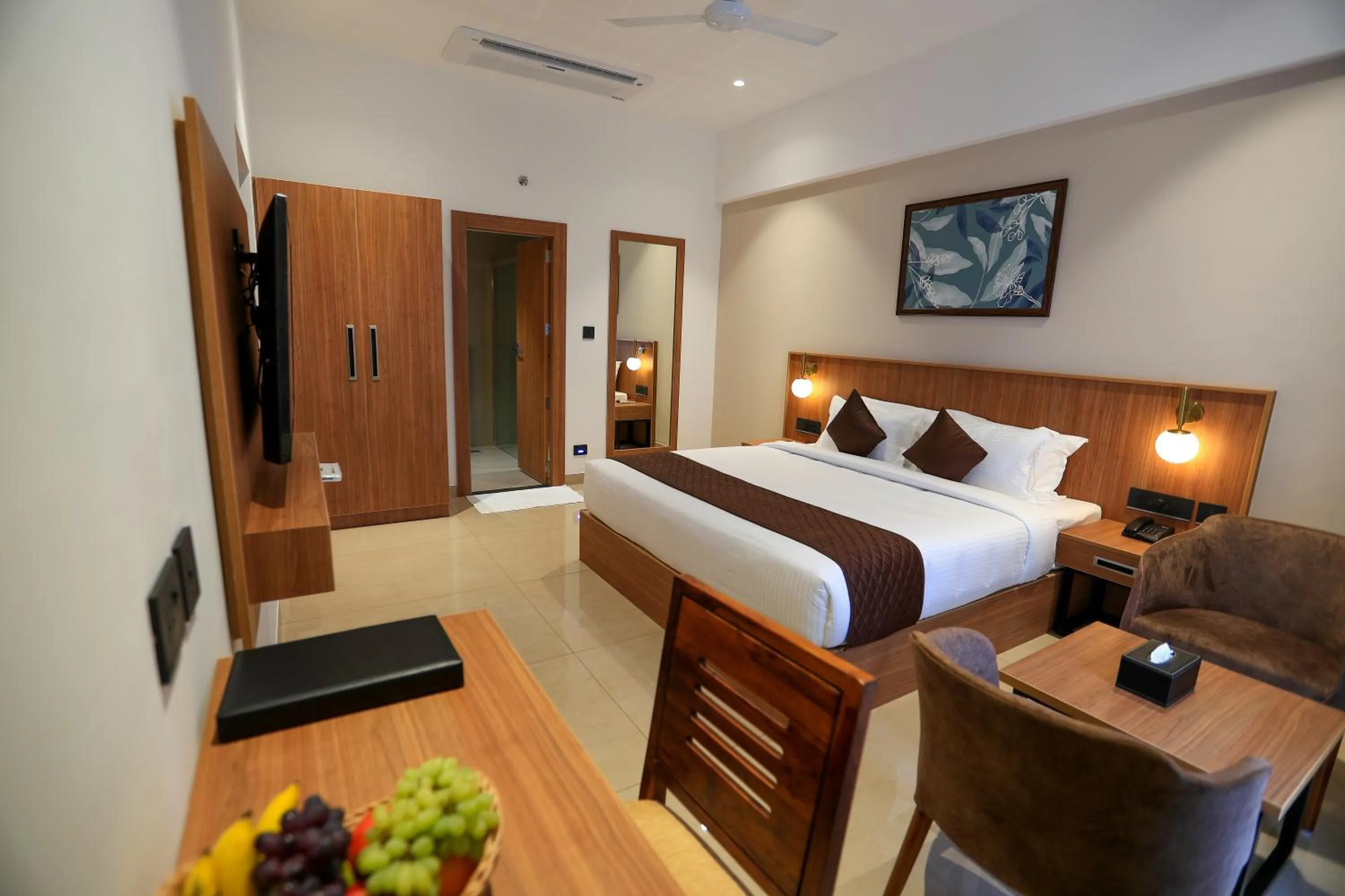 Bed in Hotel Saffron Wayanad