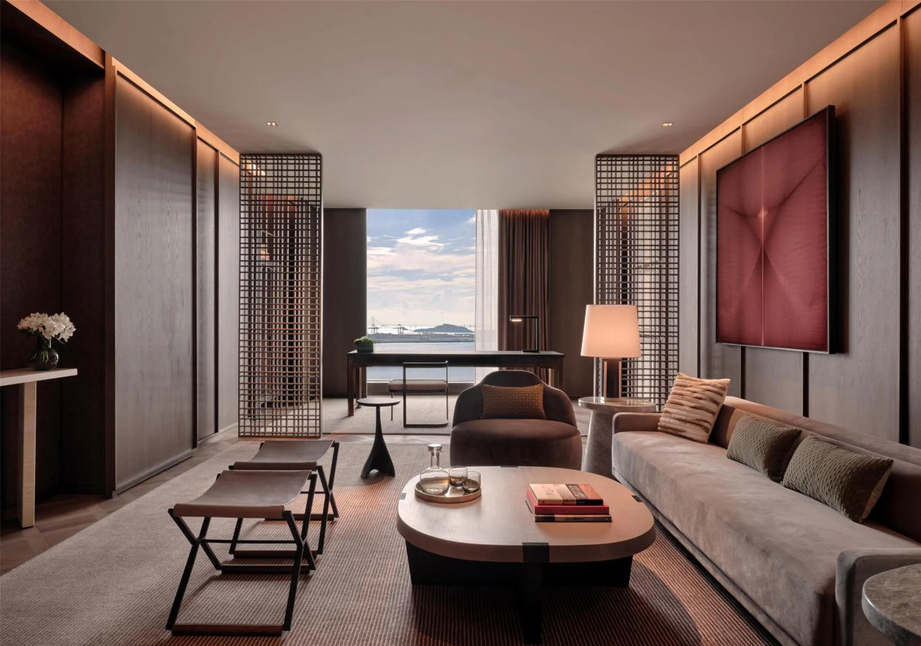 Living room in Conrad Shenzhen, the first art museum hotel in Greater Bay Area with the stunning bay and sunset view in the hotel terrace