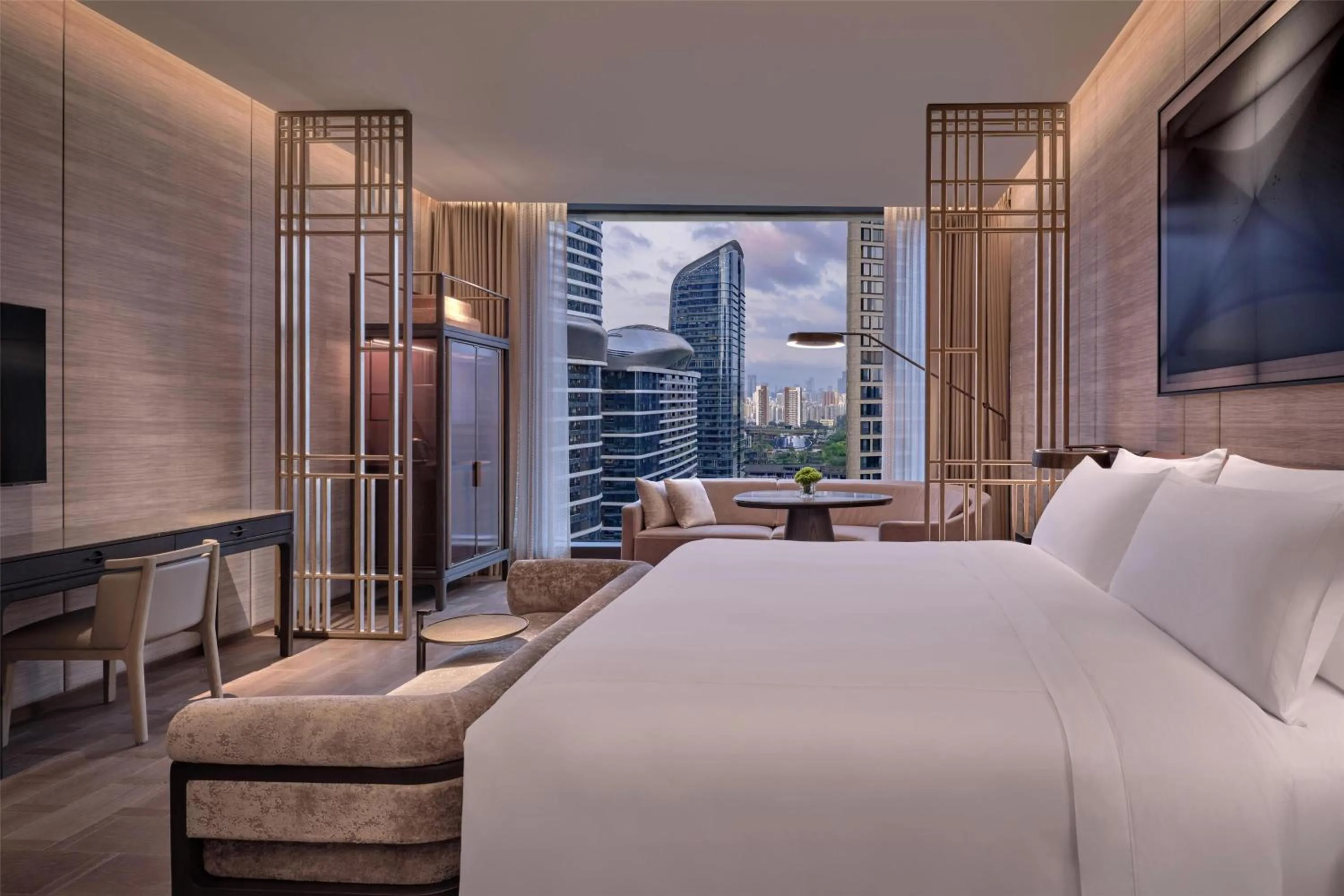 Bed in Conrad Shenzhen, the first art museum hotel in Greater Bay Area with the stunning bay and sunset view in the hotel terrace