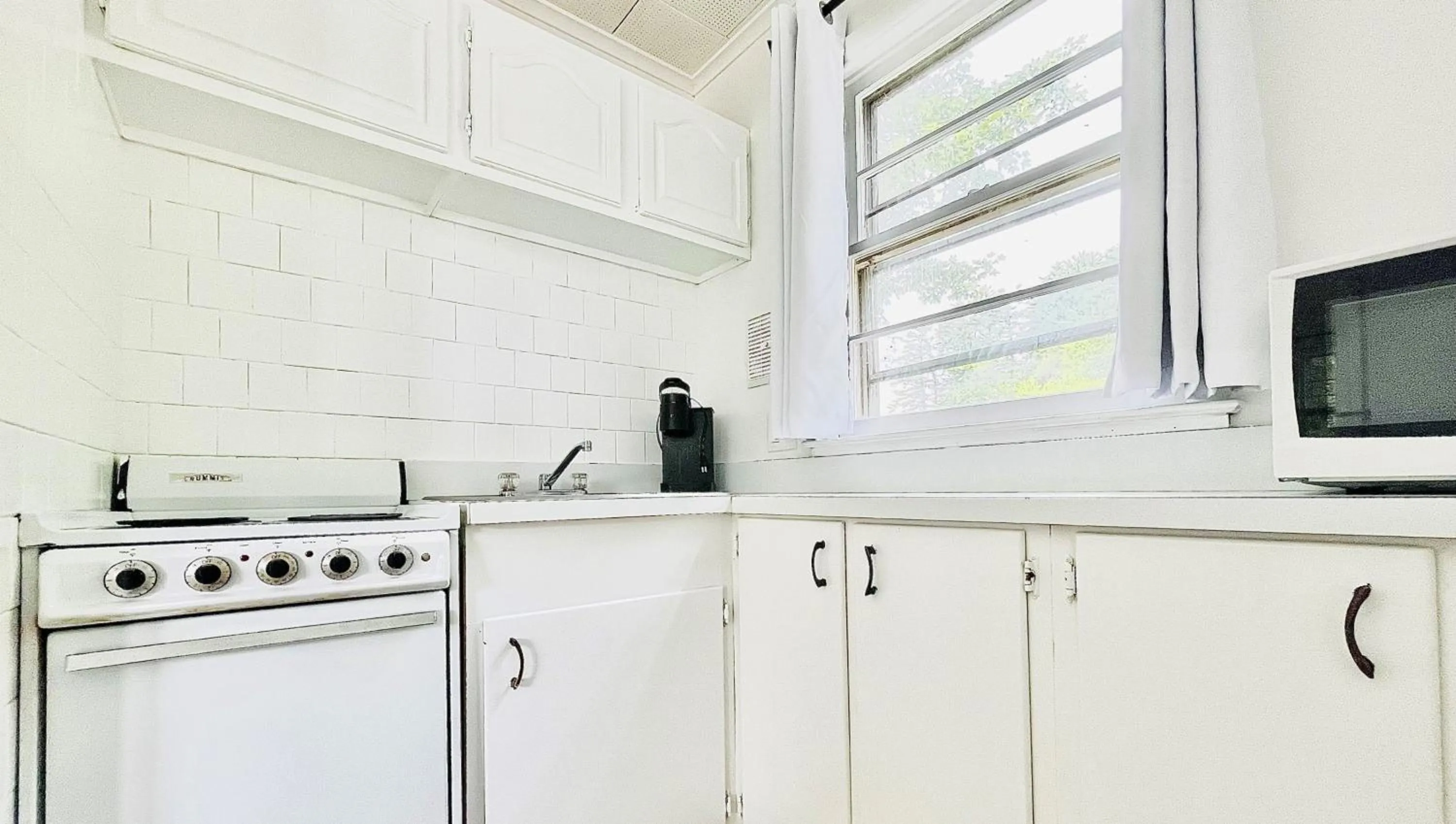 Kitchen or kitchenette in Motel Luzerne