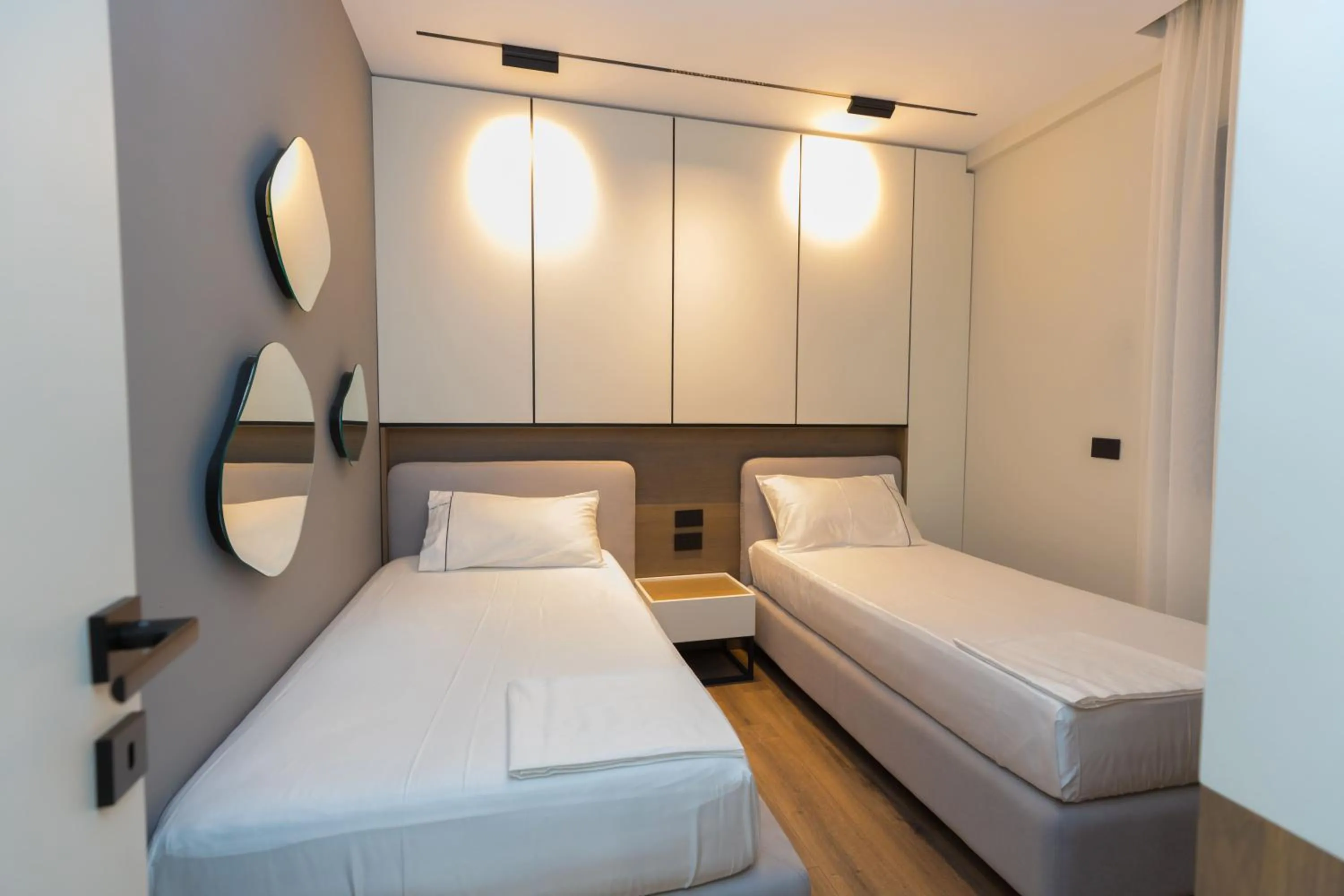 Bed in Miramare Apartments