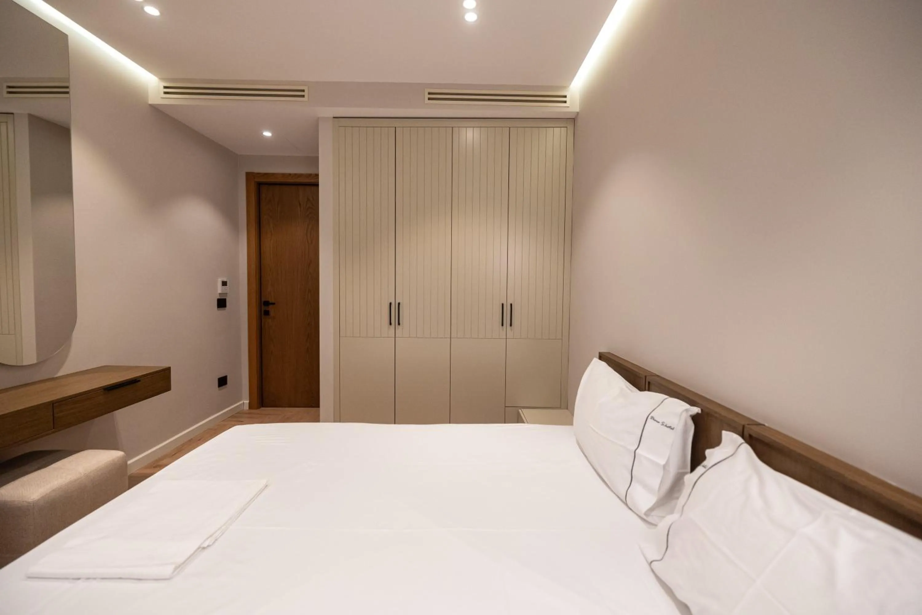 Bed in Miramare Apartments