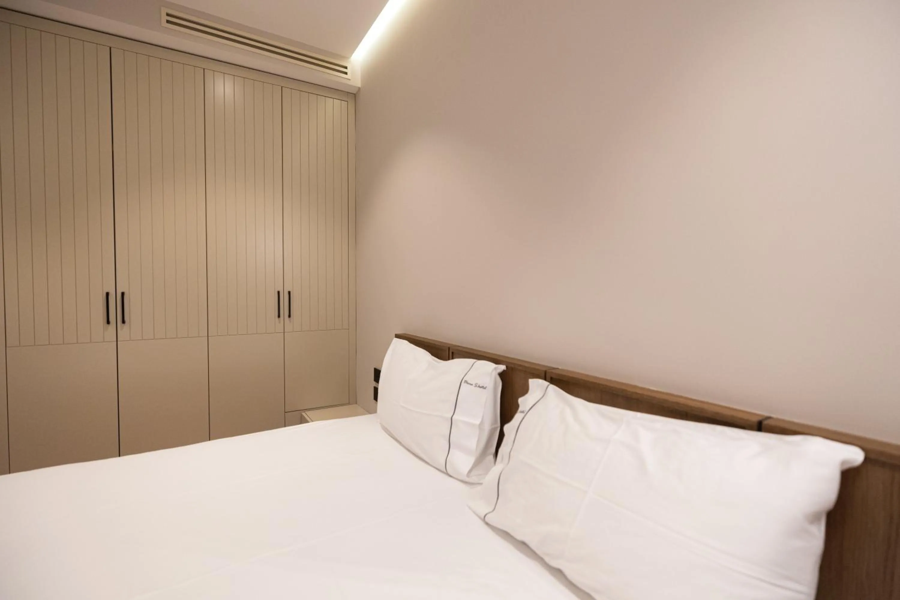 Bed in Miramare Apartments