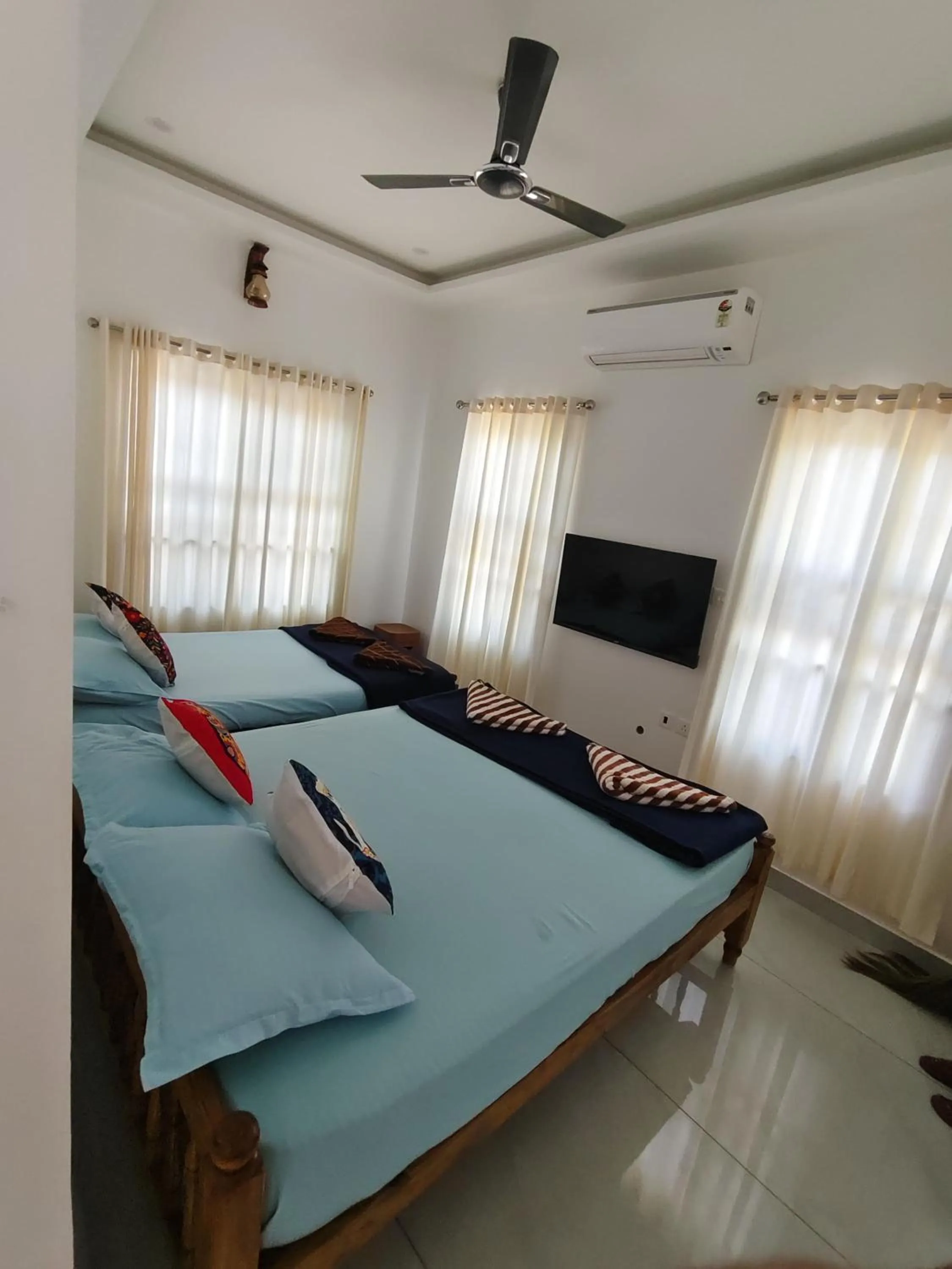 Bed in NALINAM HOMESTAY