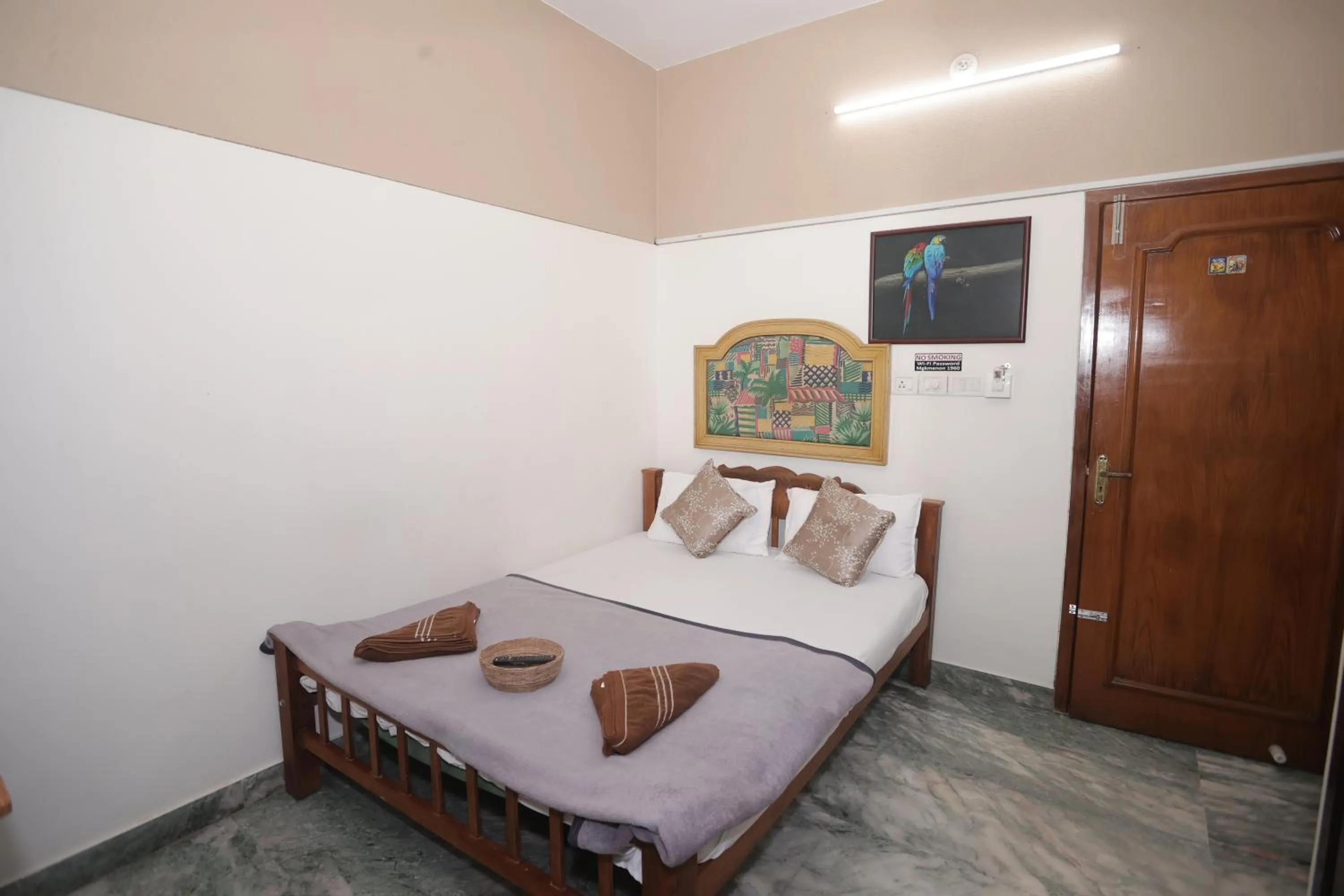 Bed in NALINAM HOMESTAY