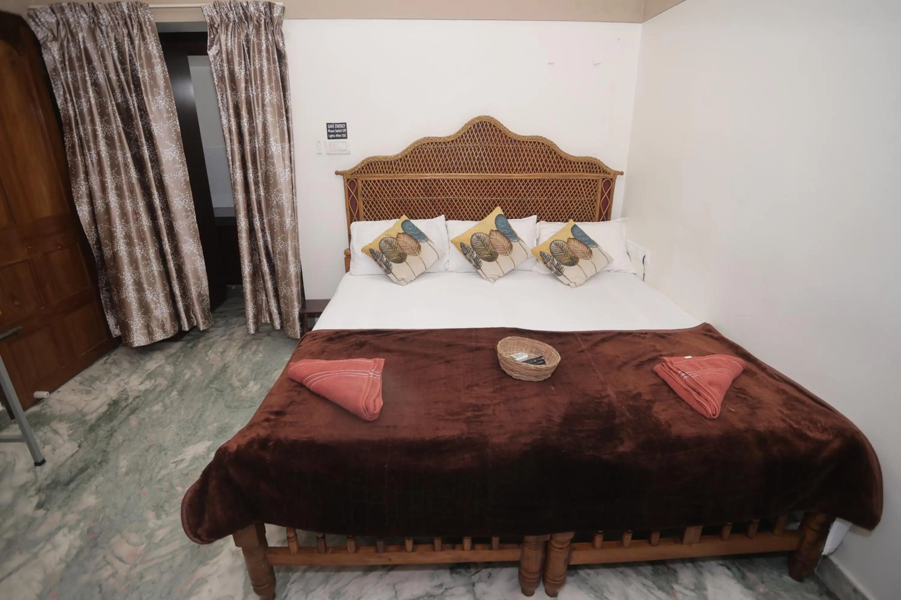 Bed in NALINAM HOMESTAY