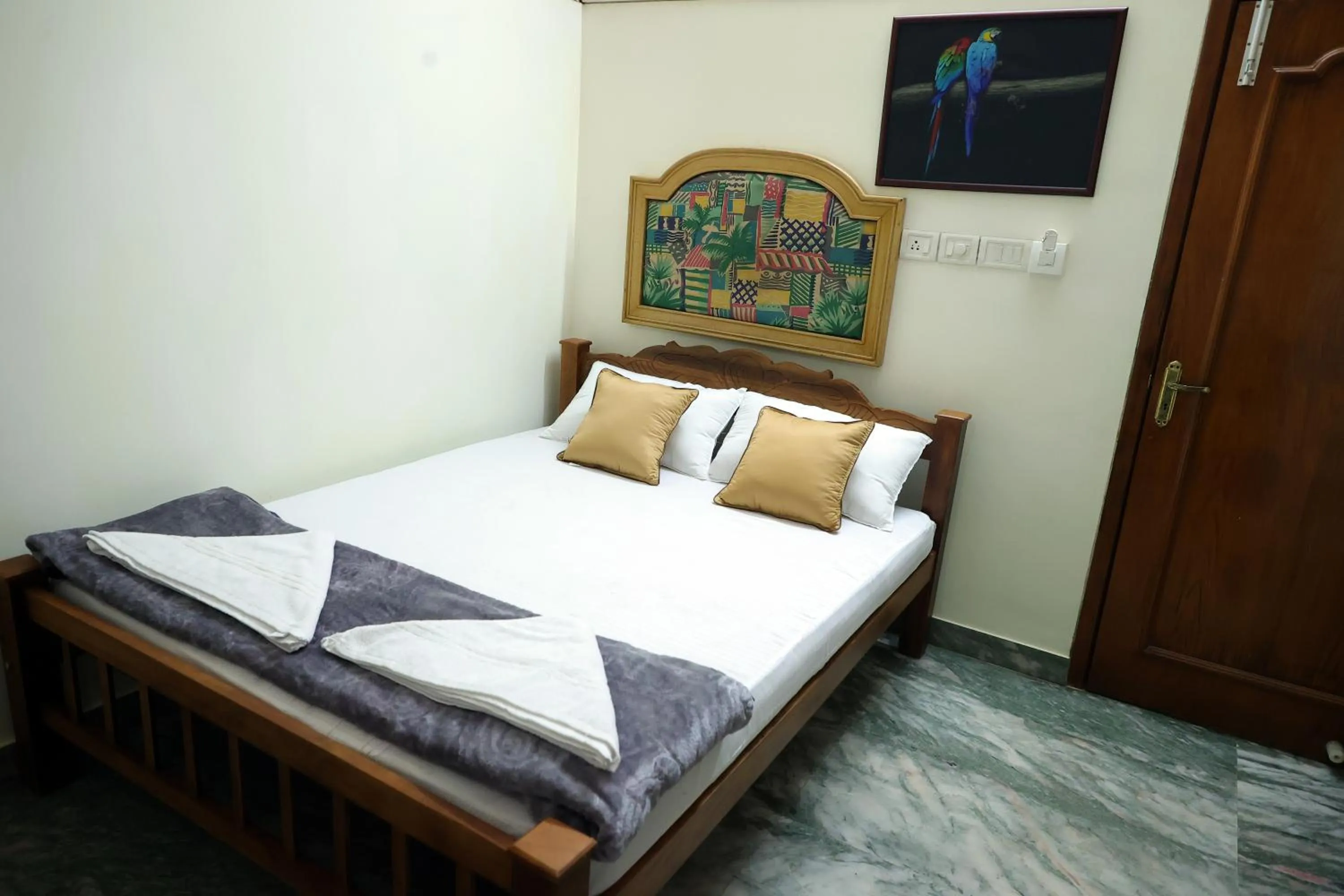 Bed in NALINAM HOMESTAY