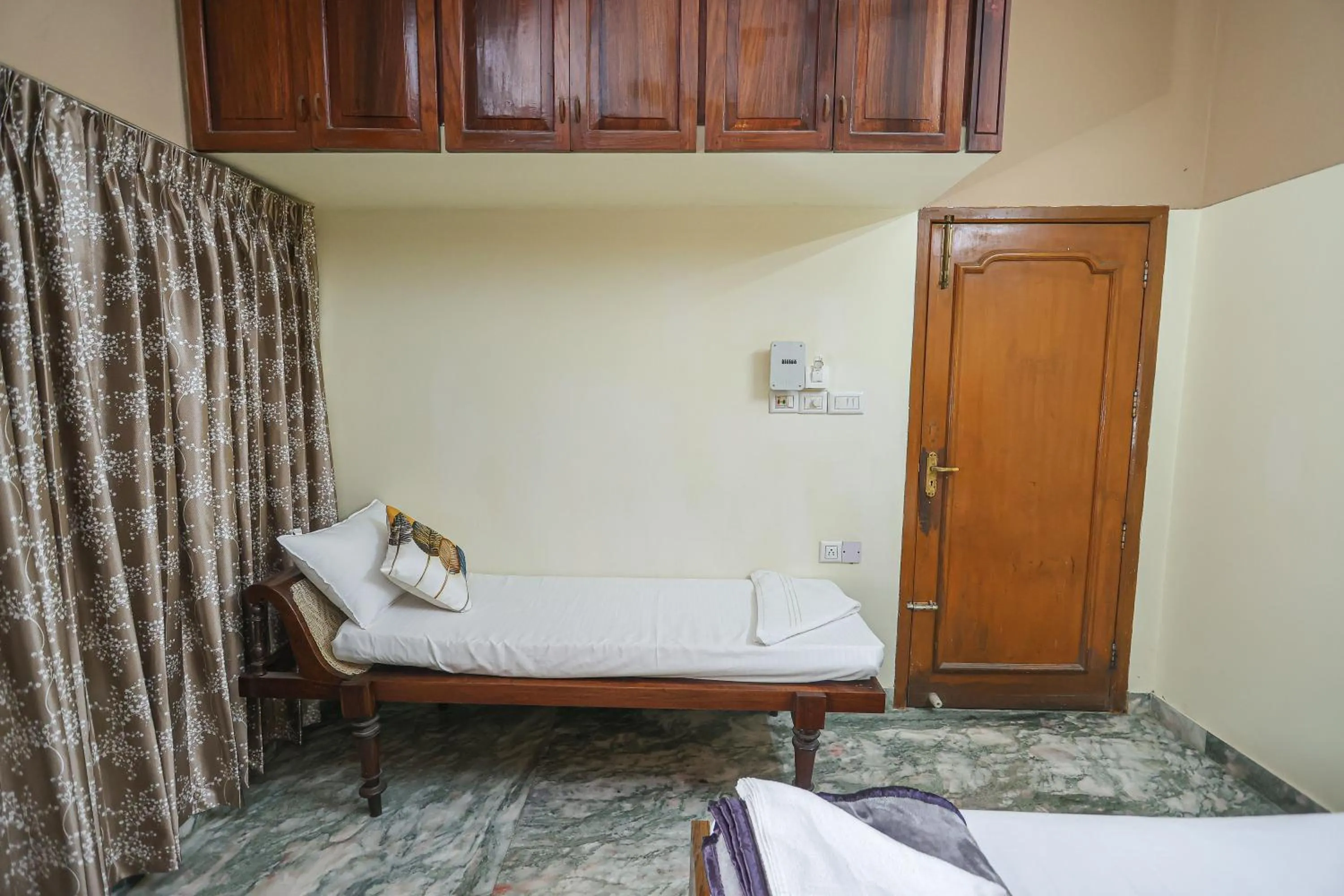 Bed in NALINAM HOMESTAY