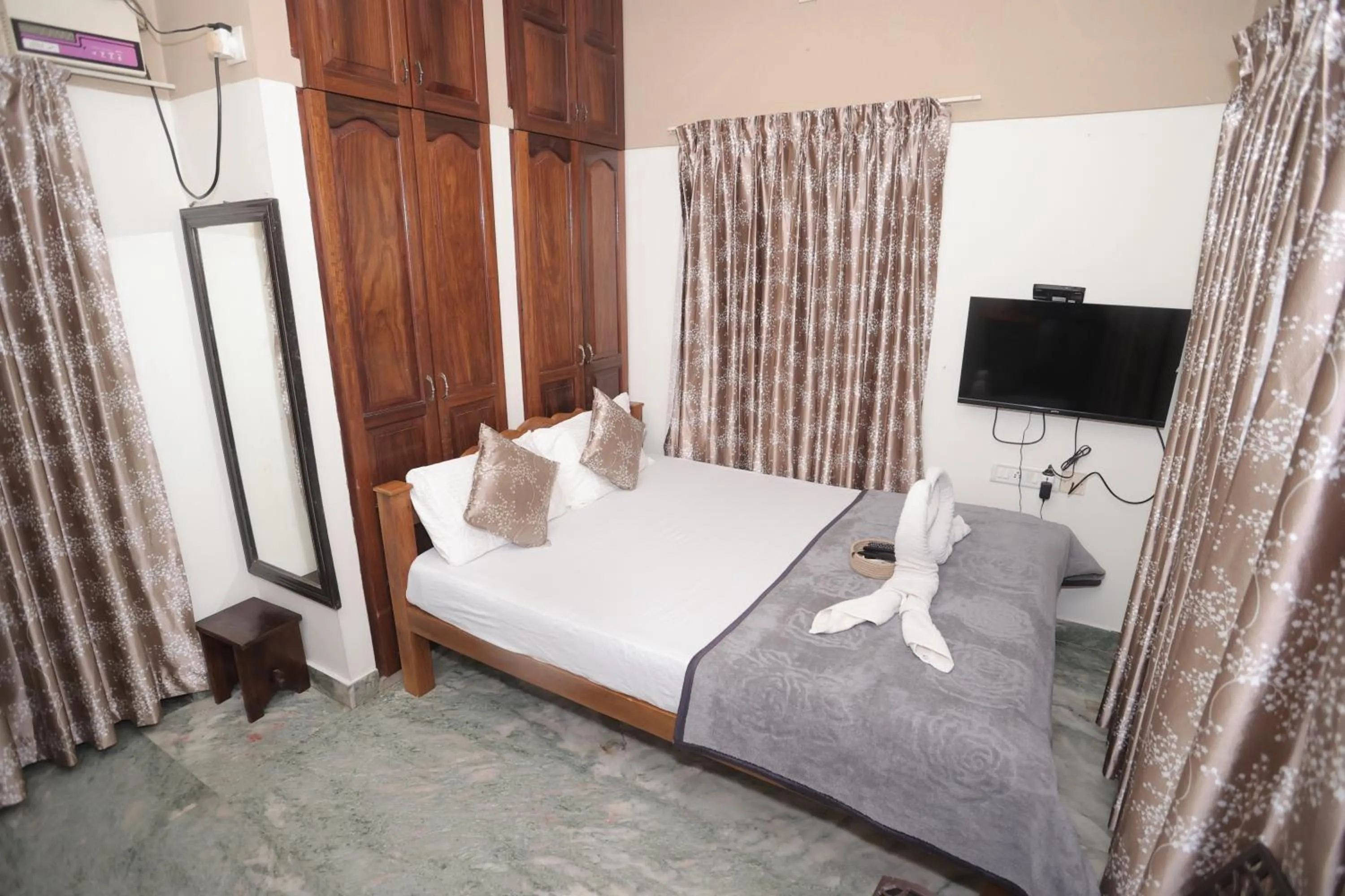 Bed in NALINAM HOMESTAY