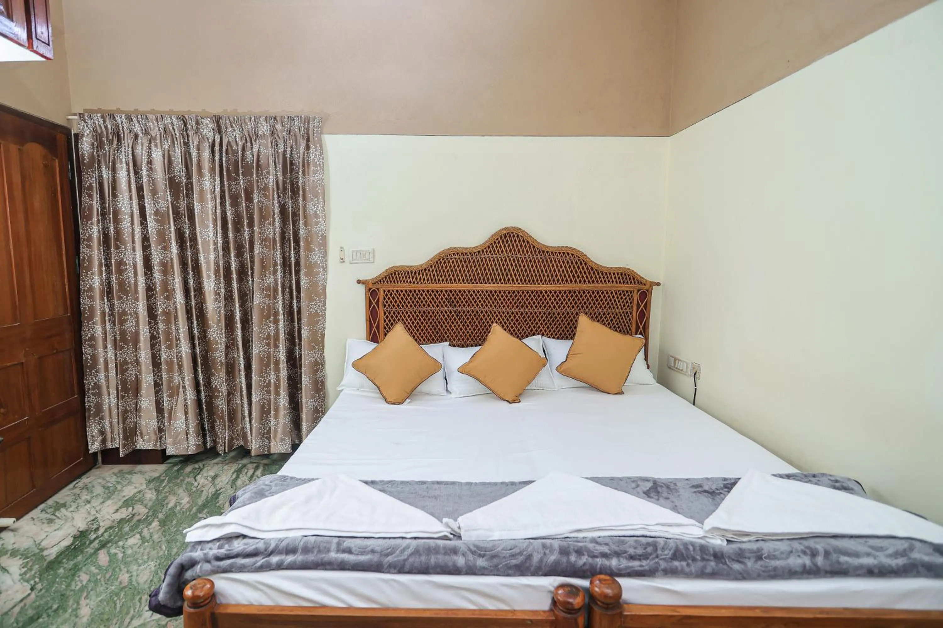 Bed in NALINAM HOMESTAY