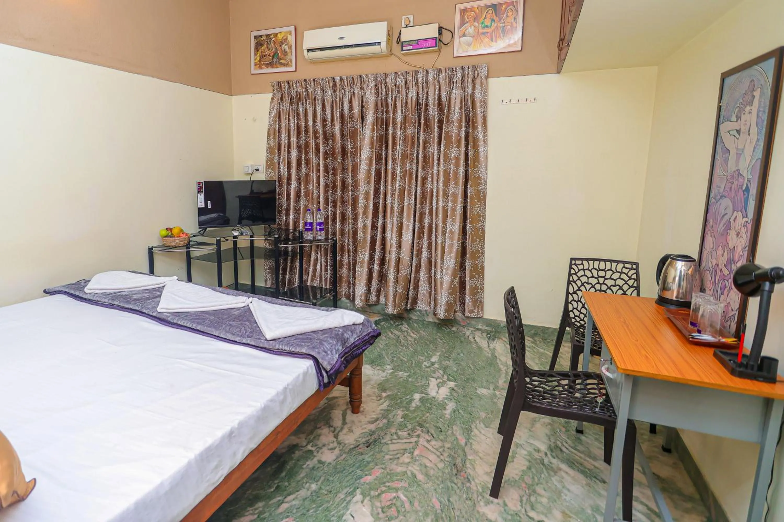 Bed in NALINAM HOMESTAY