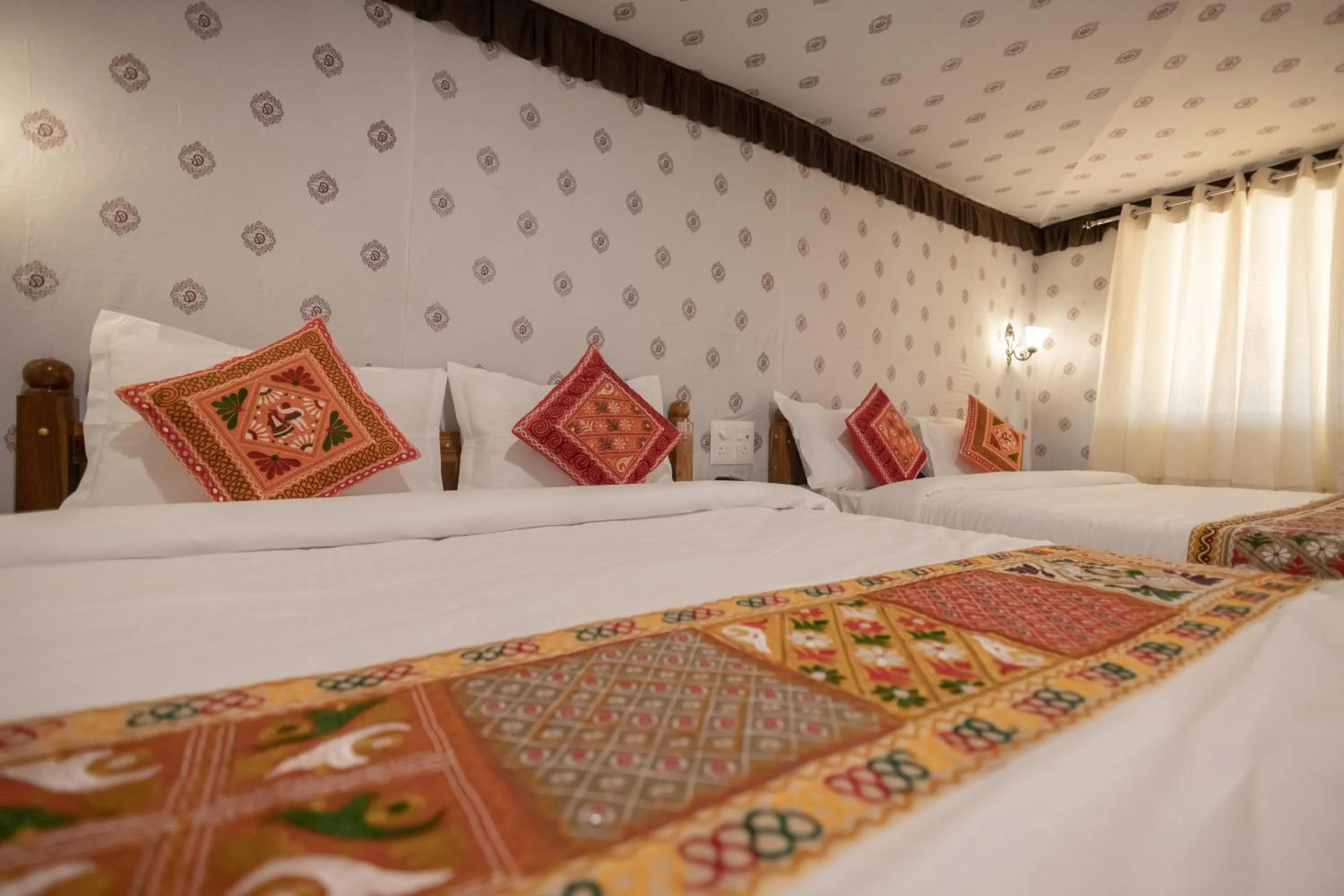 Bed in Vasant Vihar Resort