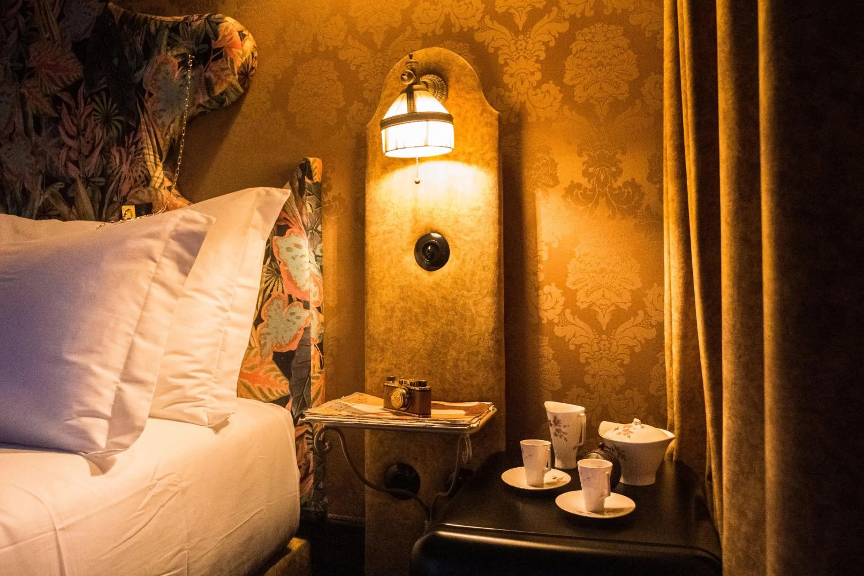 Bed in Pensão Amor Madam's Lodge