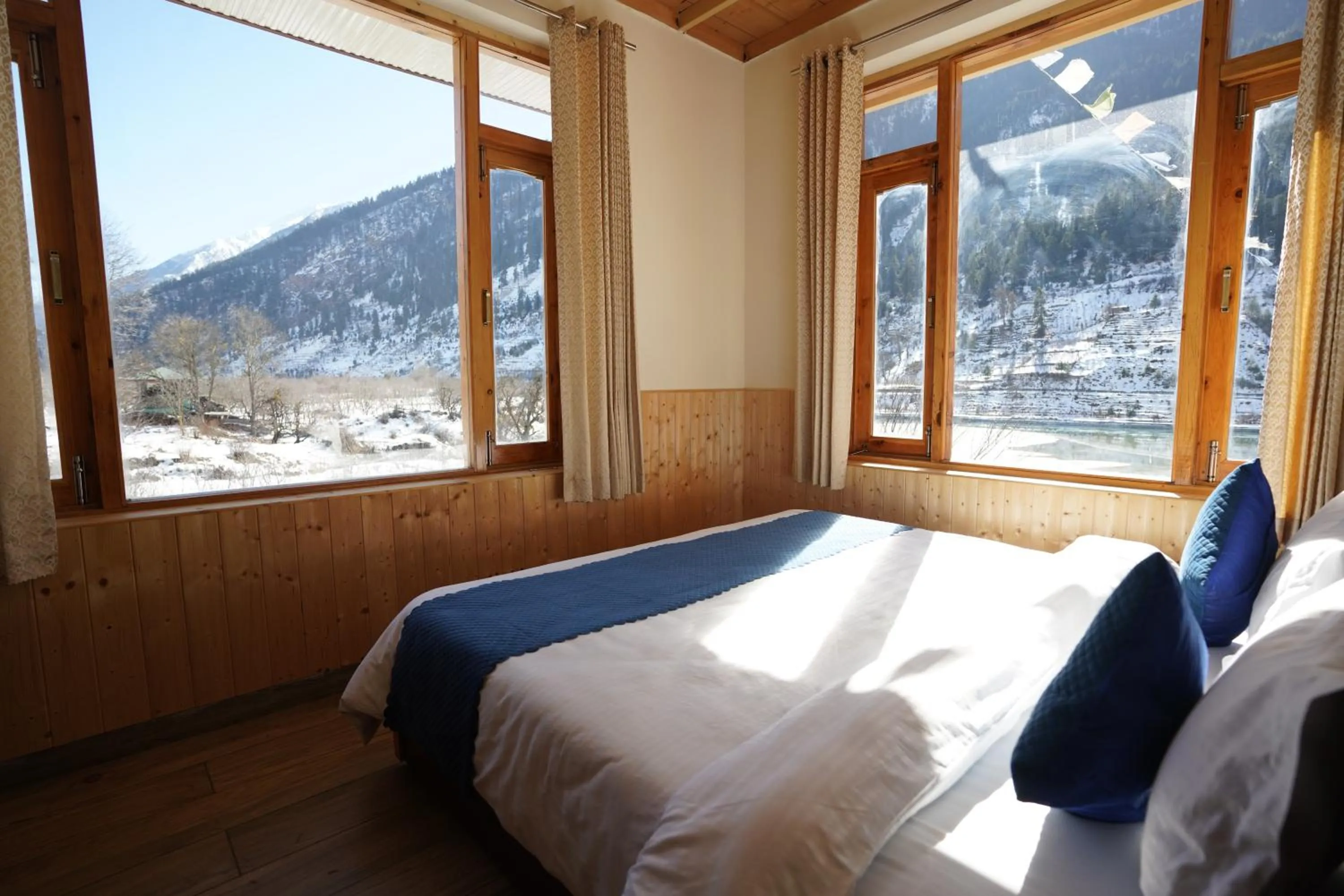 Bed in The Kamru Riverside Camps and Resorts