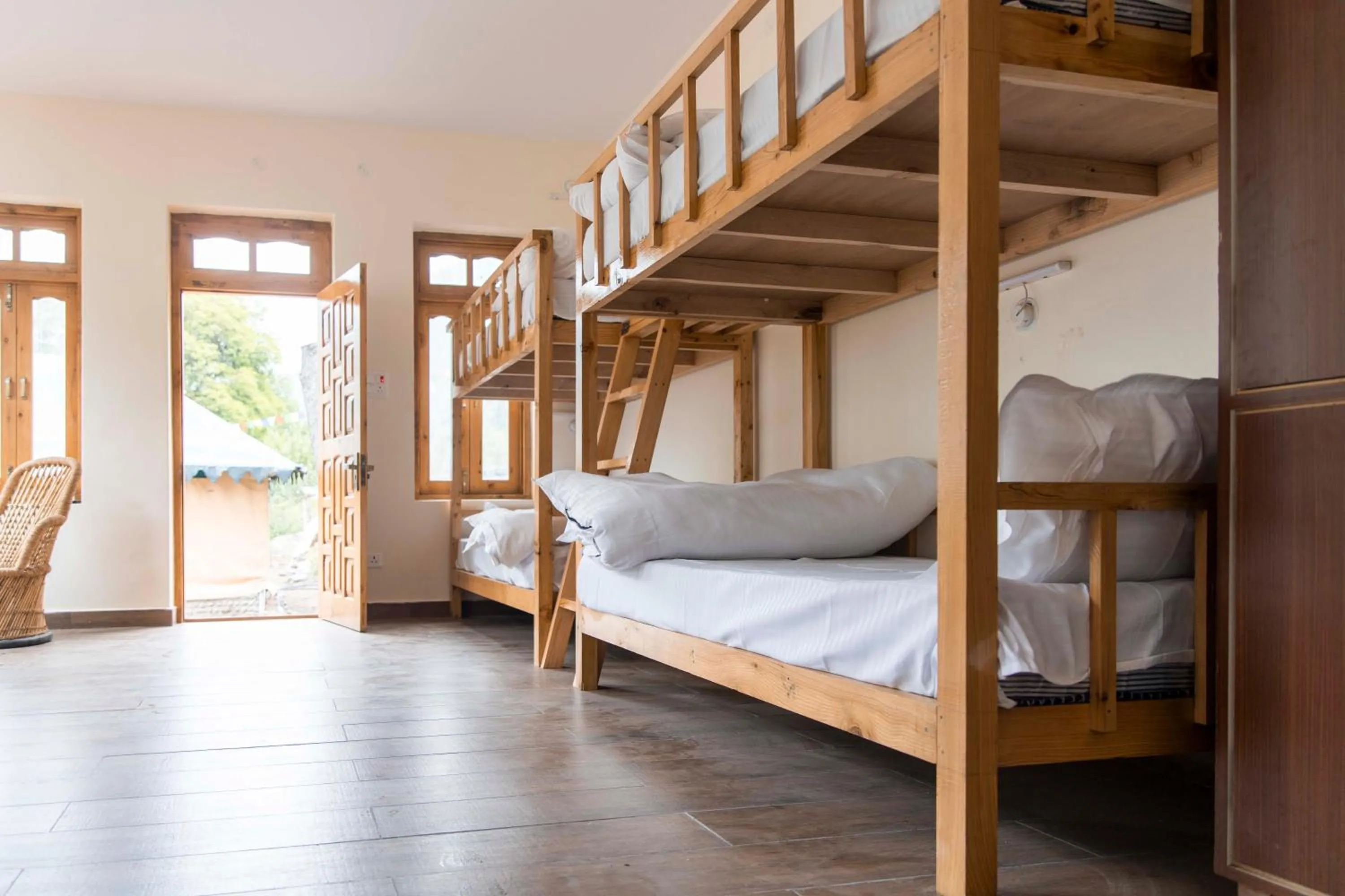 Bed in The Kamru Riverside Camps and Resorts