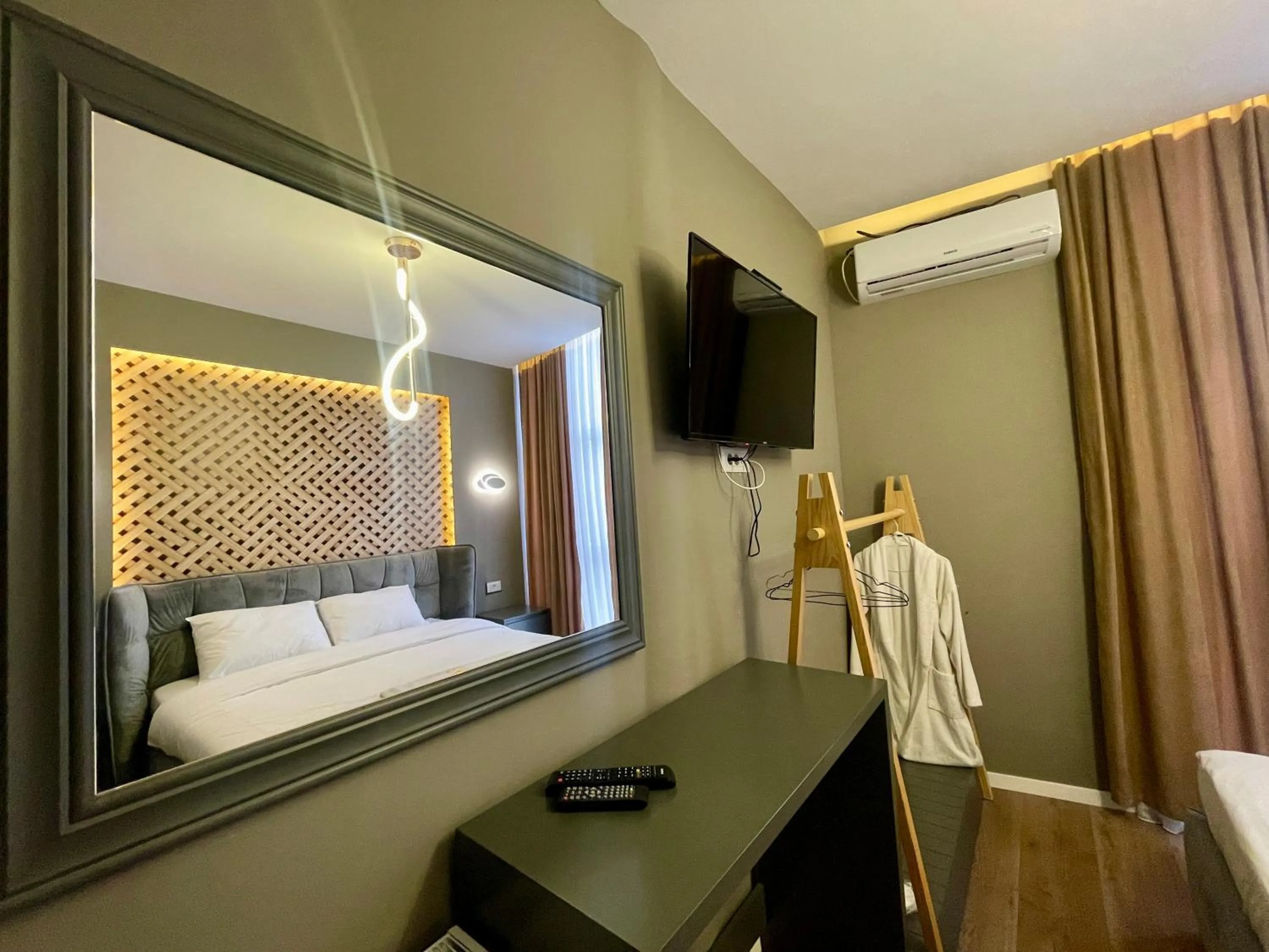 Bed in GRAND JNK Boutique Hotel