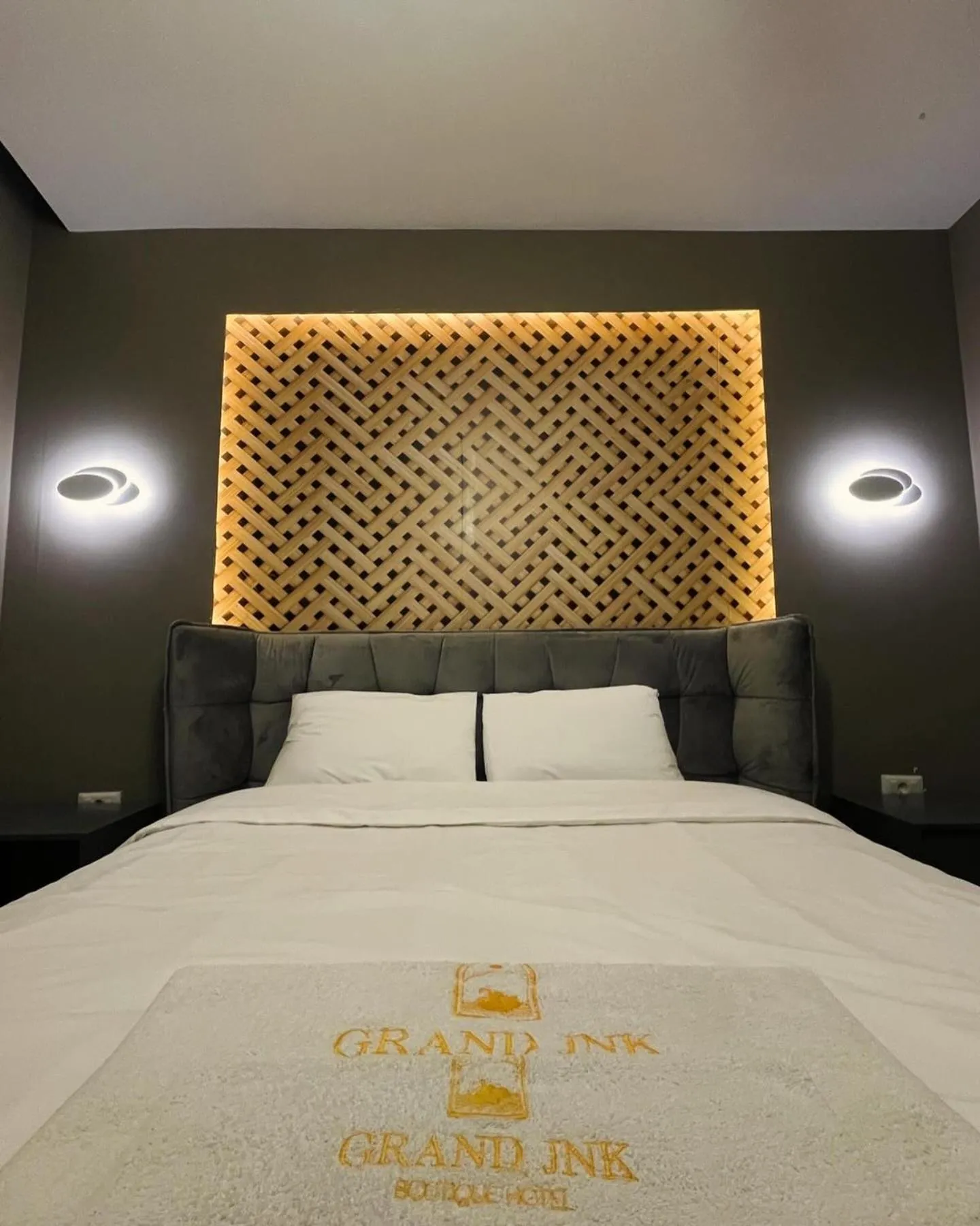 Bed in GRAND JNK Boutique Hotel
