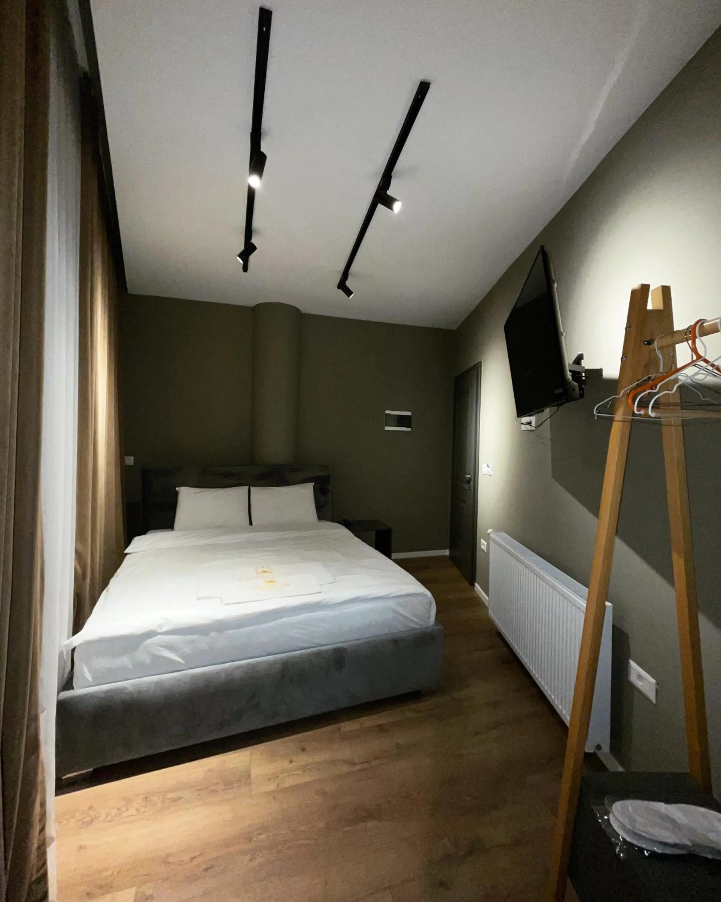 Bed in GRAND JNK Boutique Hotel