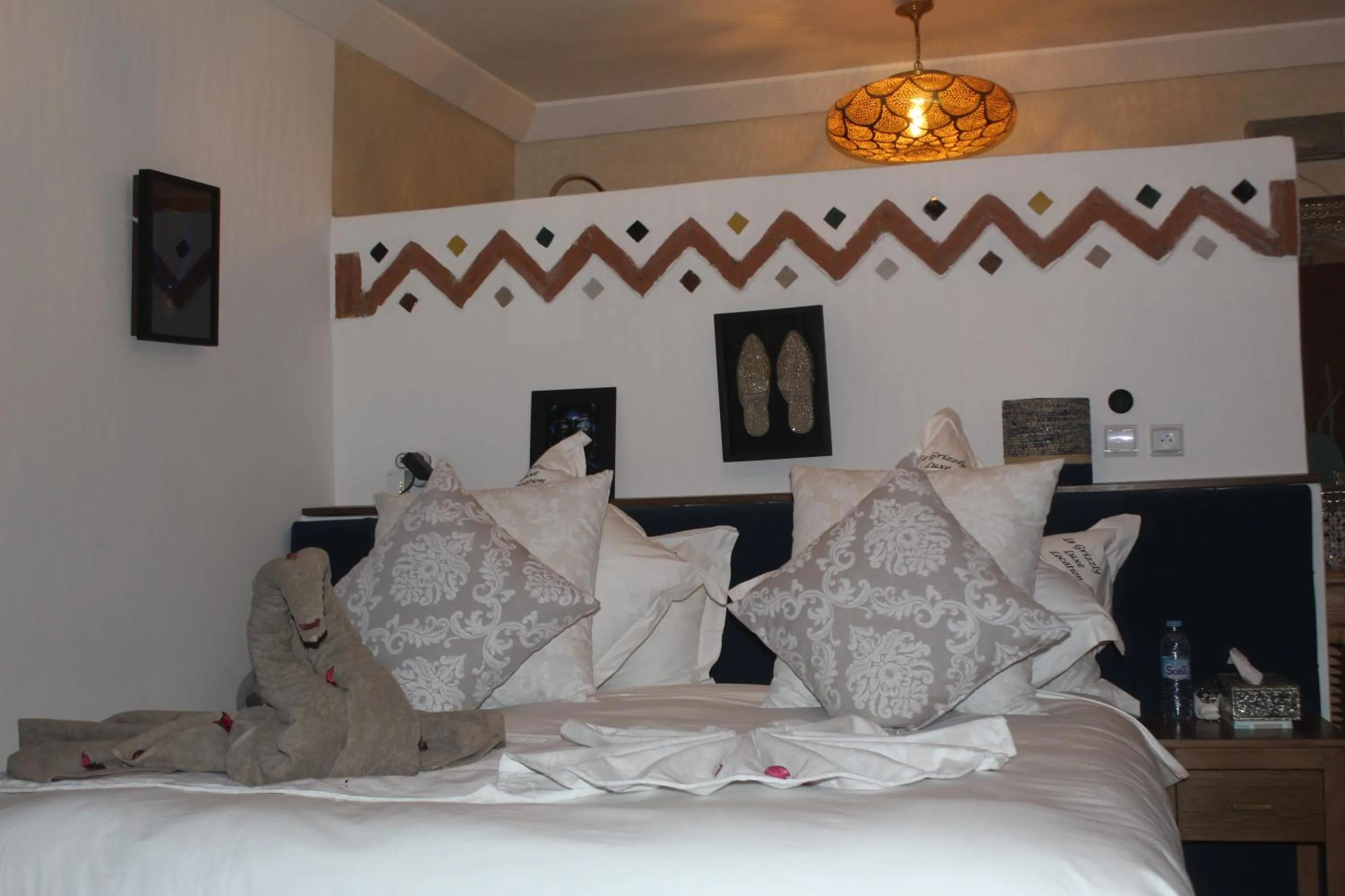 Bed in RIAD LUXE LOCATION le GRIZZLY