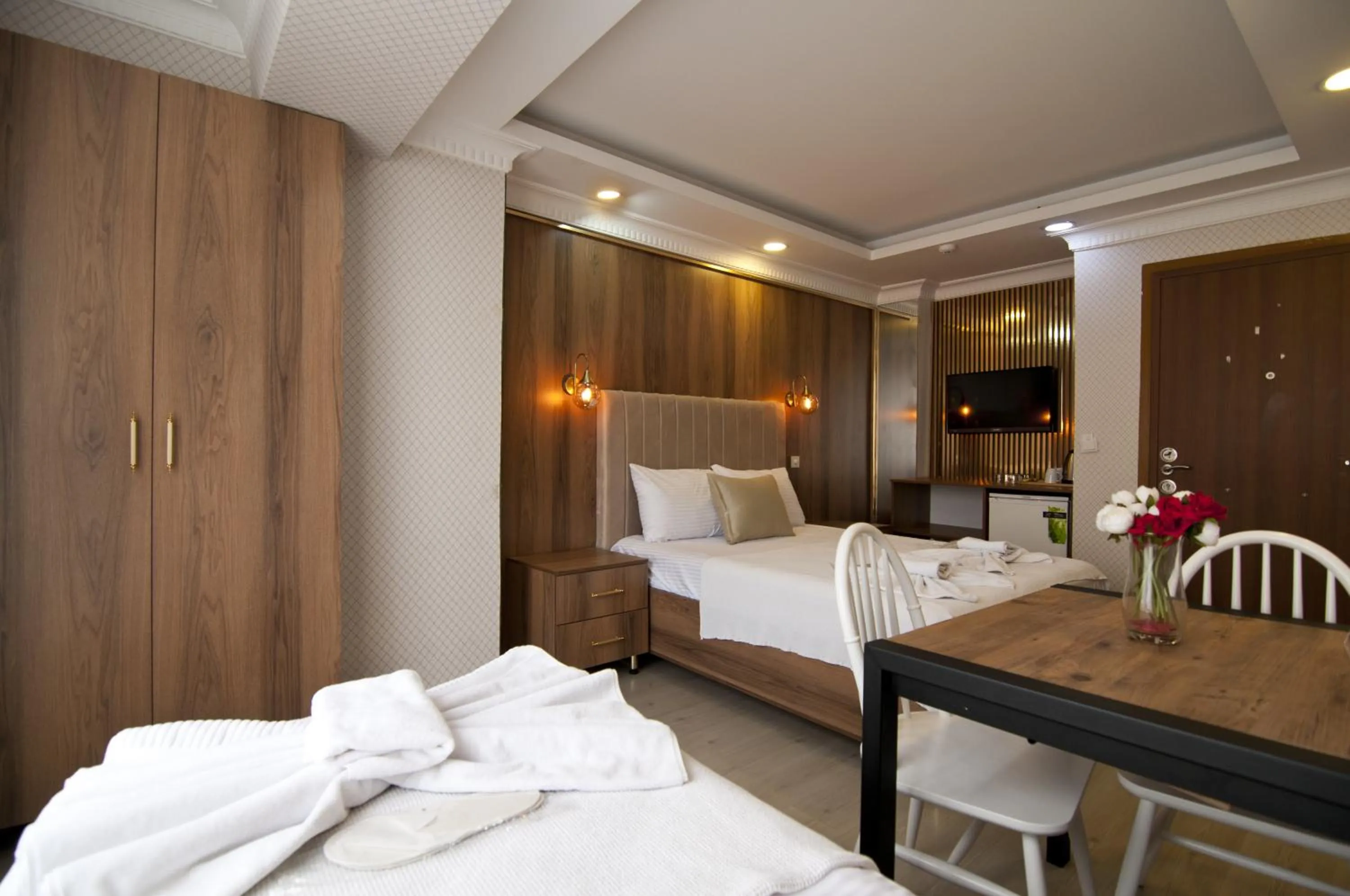 Bed in IMMORTELLE HOTEL