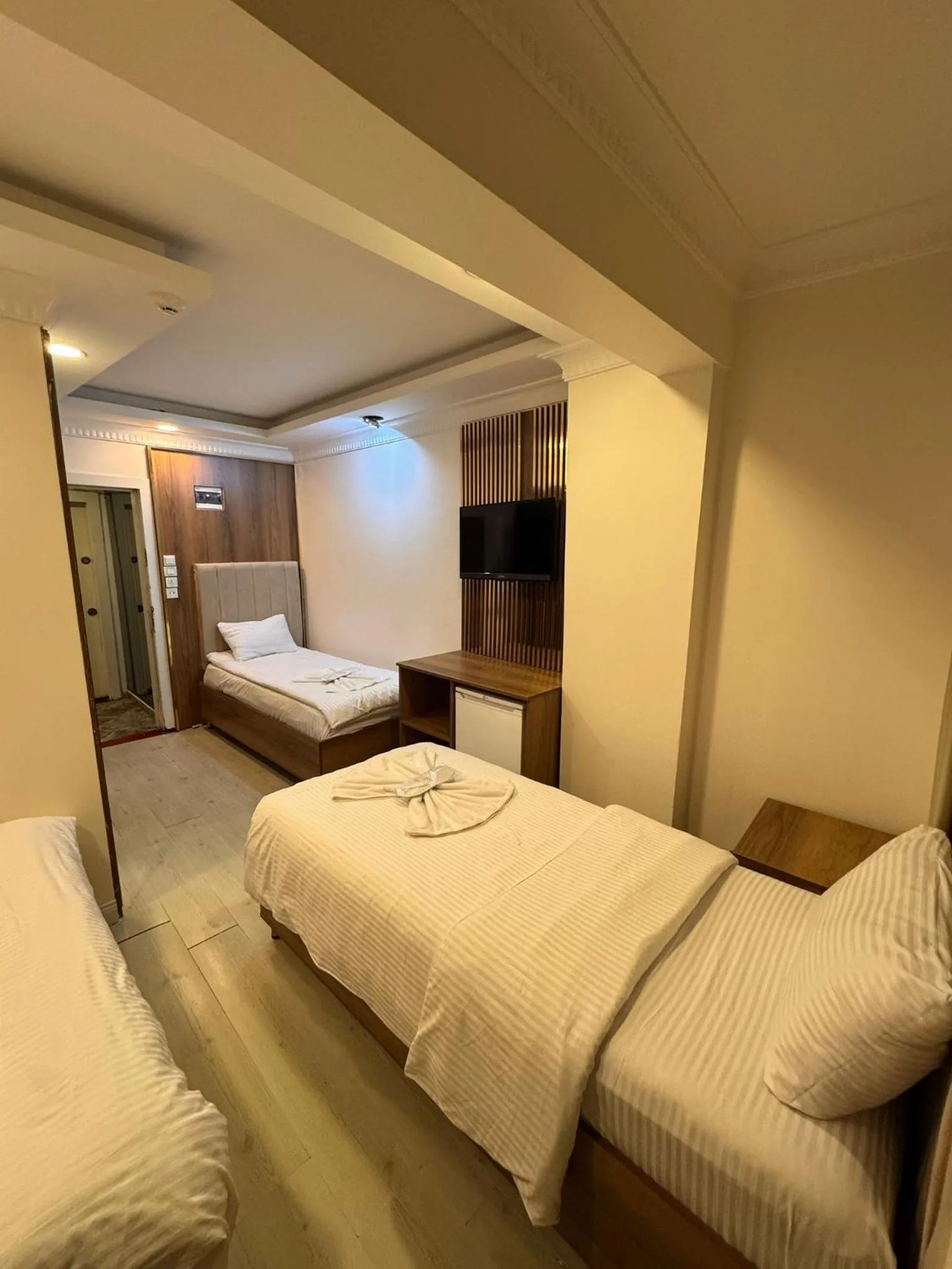 Bed in IMMORTELLE HOTEL