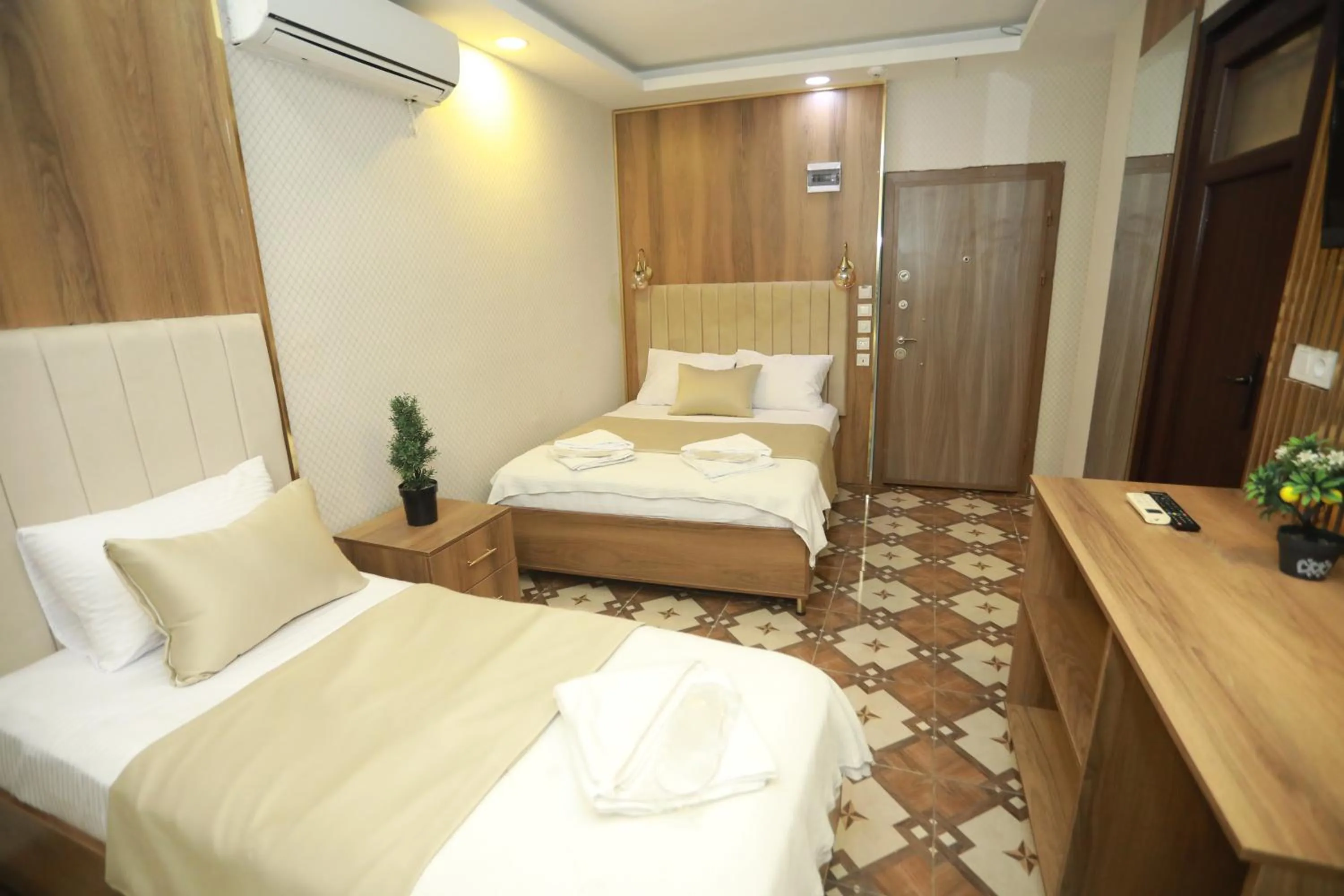 Bed in IMMORTELLE HOTEL