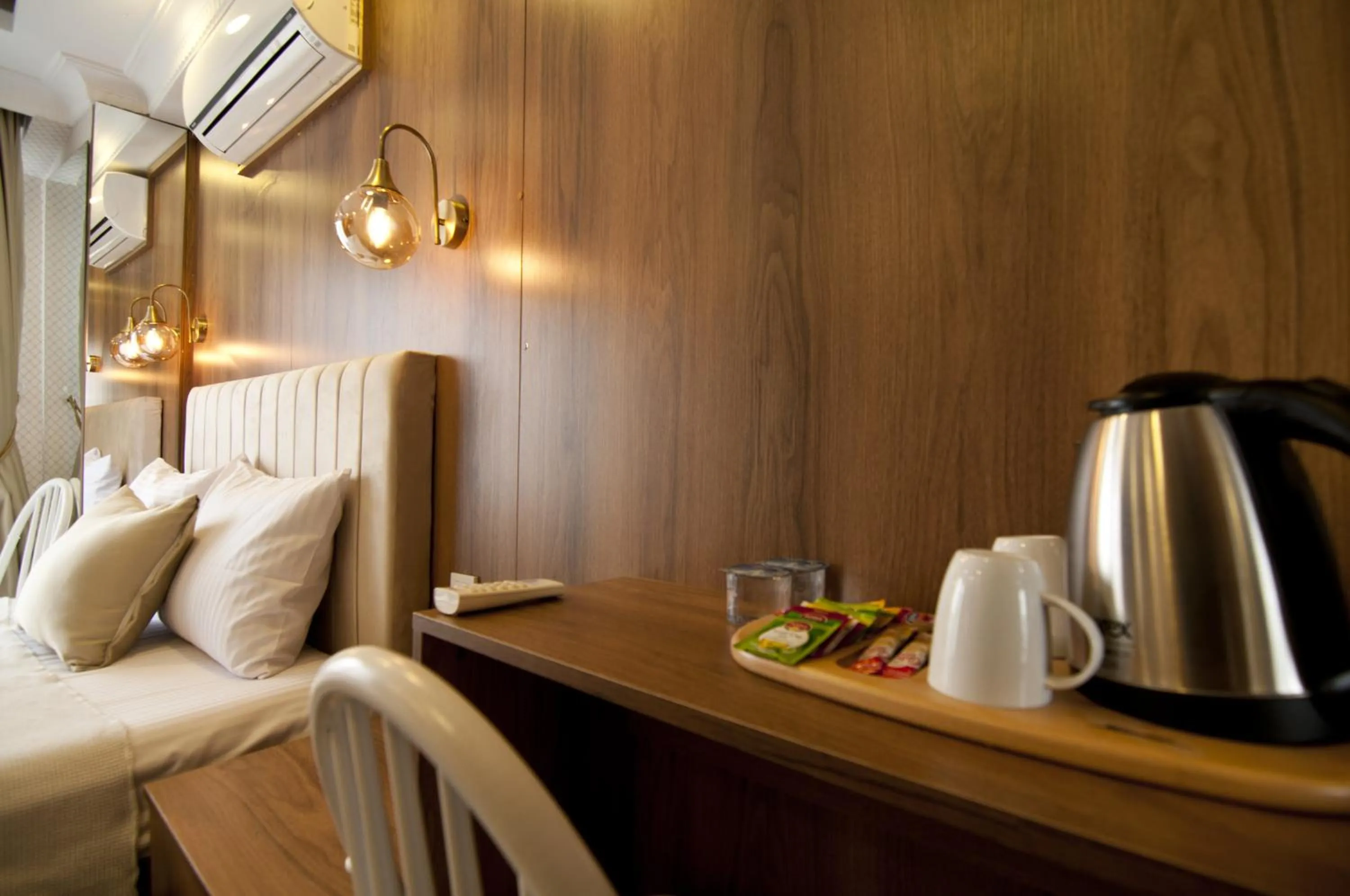 Bed in IMMORTELLE HOTEL