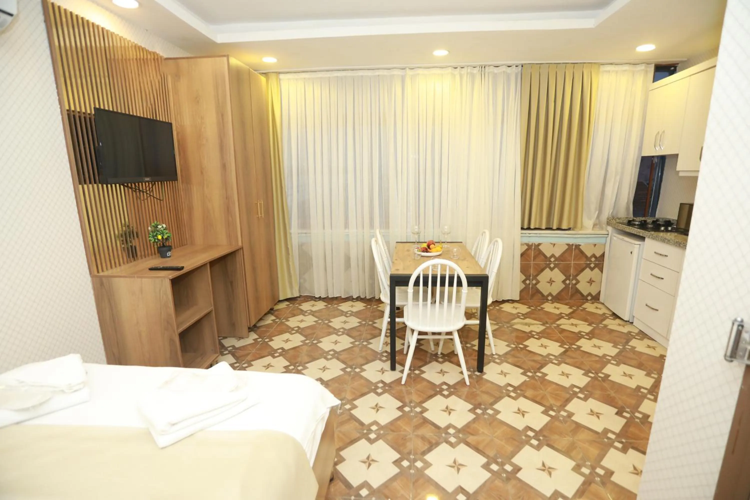 Bed in IMMORTELLE HOTEL