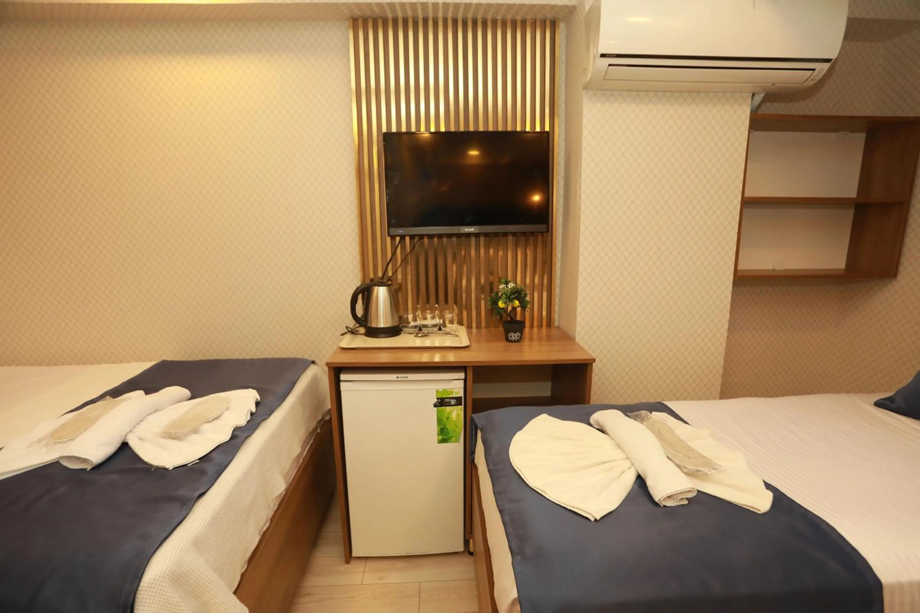 Bed in IMMORTELLE HOTEL