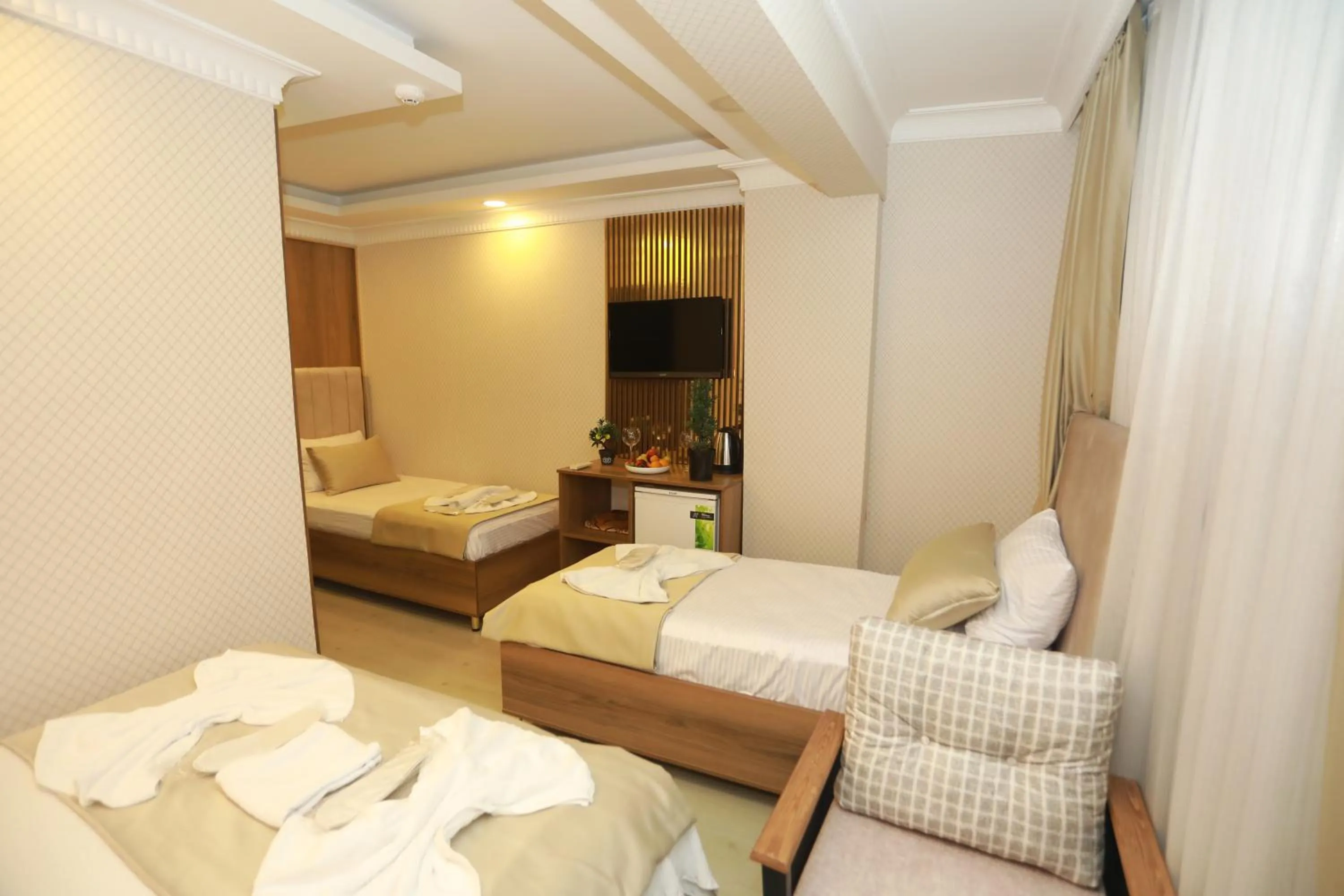 Bed in IMMORTELLE HOTEL