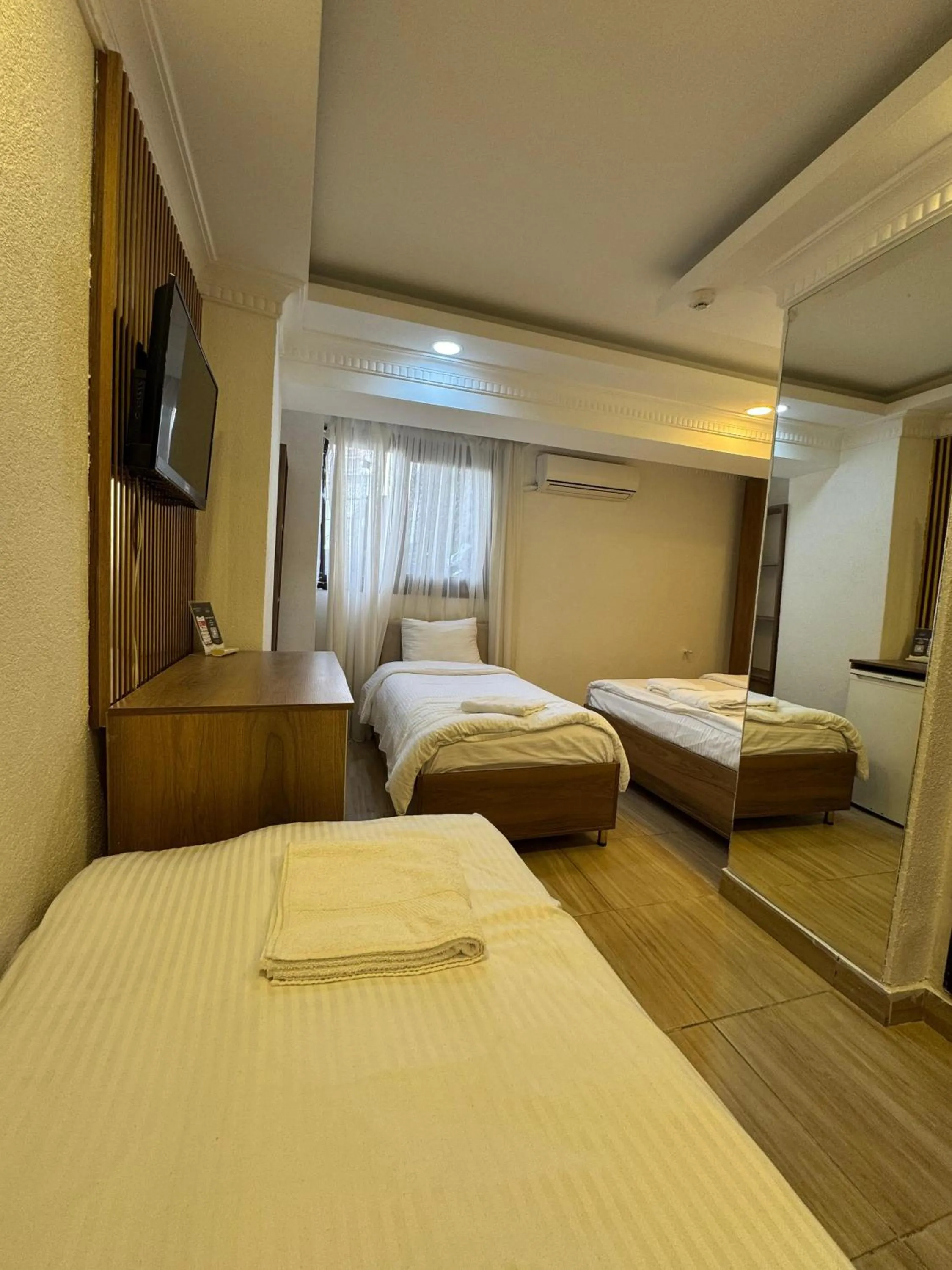 Bed in IMMORTELLE HOTEL