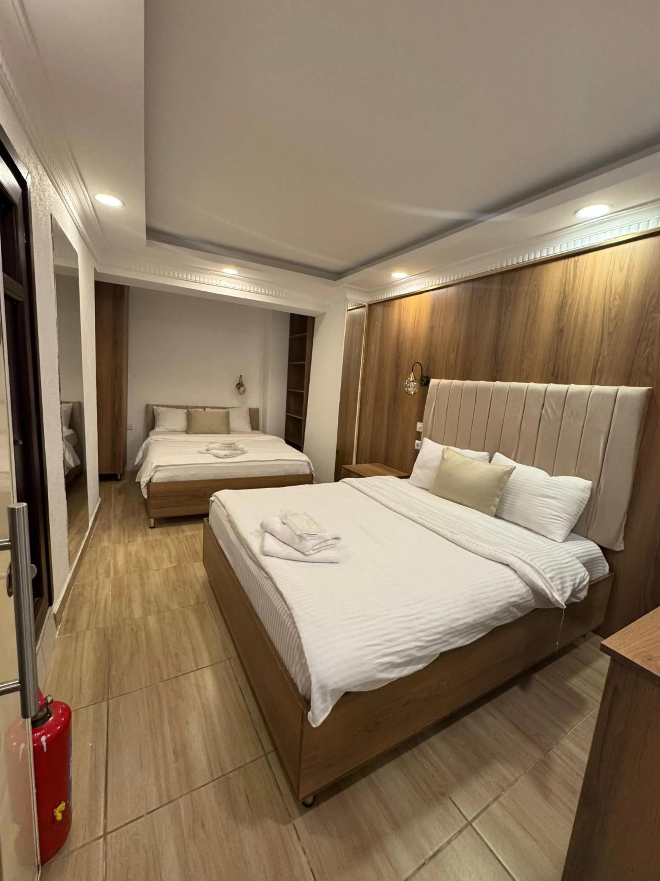 Bed in IMMORTELLE HOTEL