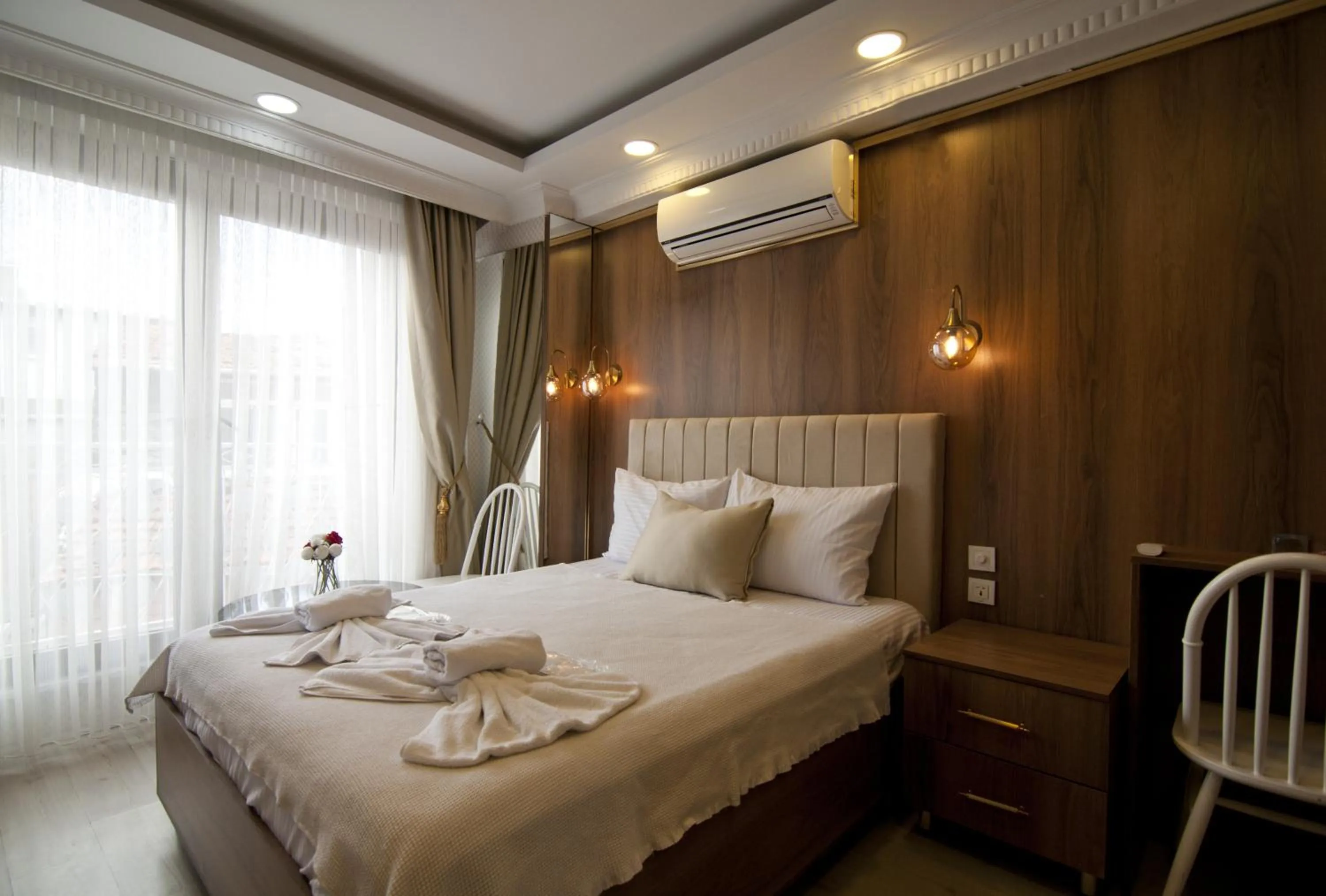 Bed in IMMORTELLE HOTEL