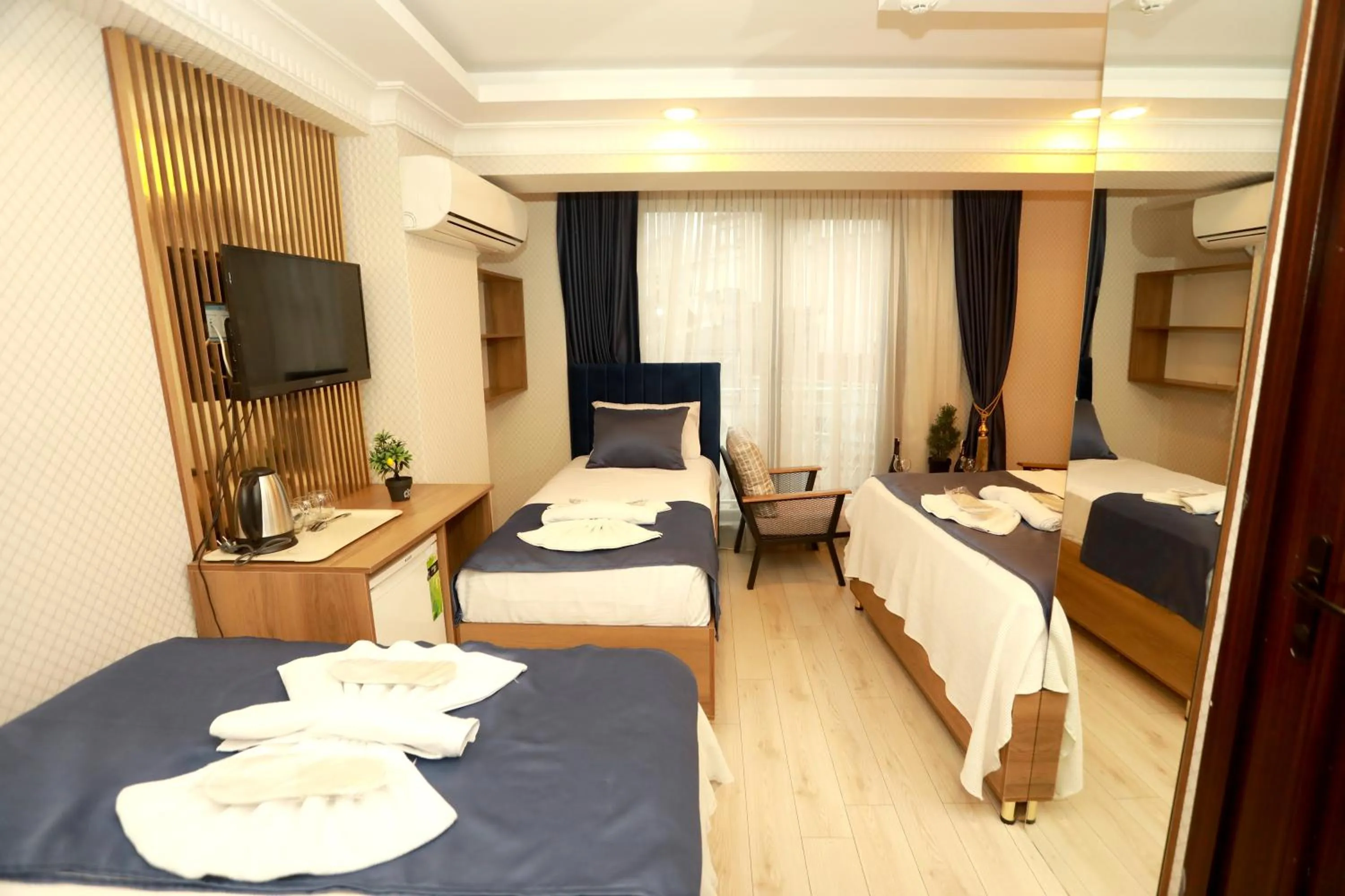 Bed in IMMORTELLE HOTEL