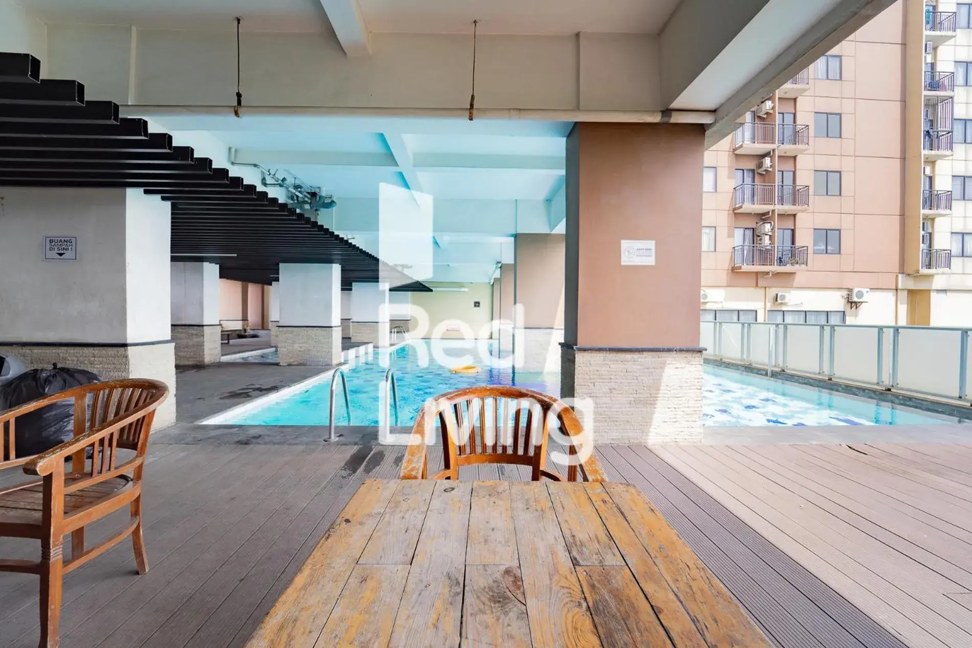 Swimming pool in RedLiving Apartemen Tamansari Panoramic - Anwar Rental Swimming pool in RedLiving Apartemen Tamansari Panoramic - Anwar Rental