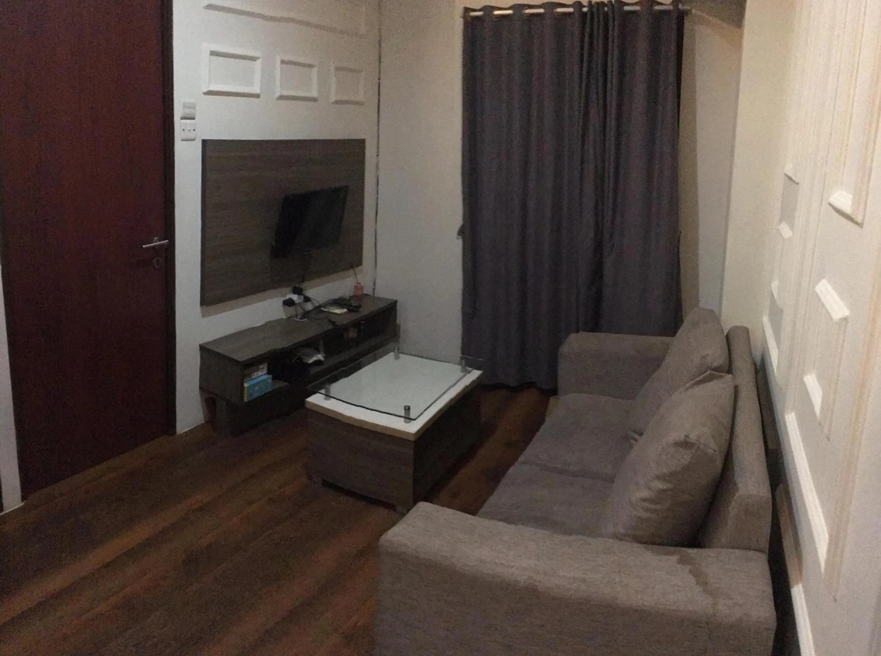 Living room in RedLiving Apartemen Tamansari Panoramic - Anwar Rental