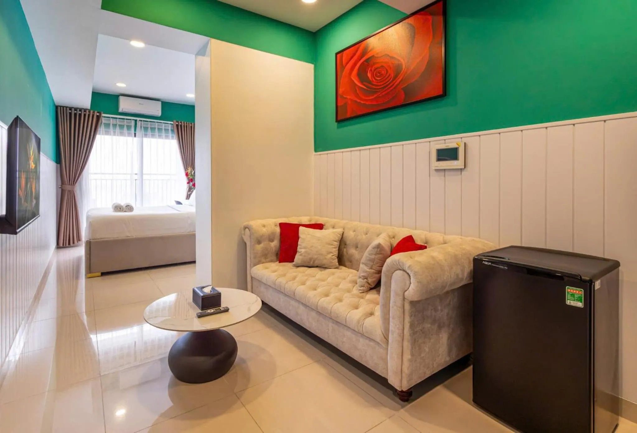 Communal lounge/ TV room in Otis Soho Saigon Balcony Apartment