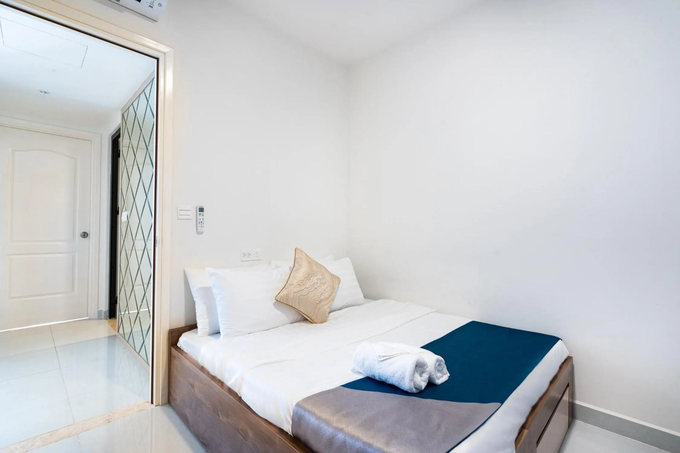 Bed in Otis Soho Saigon Balcony Apartment